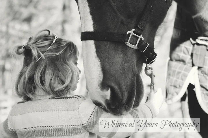 profile image of little girl and horse closeup