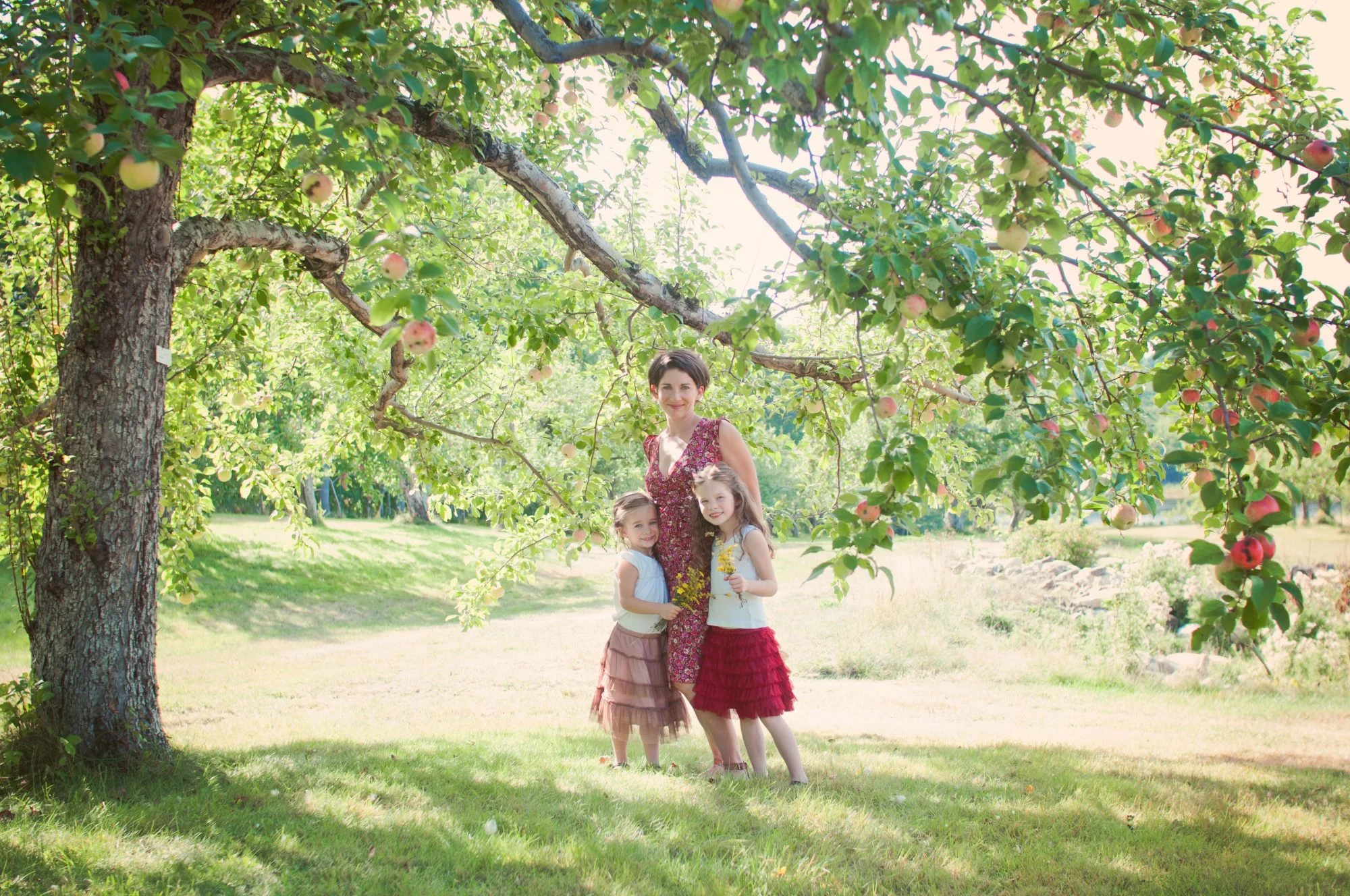 Mother and daughters portrait under apple tree at Clark's Cove Farm
