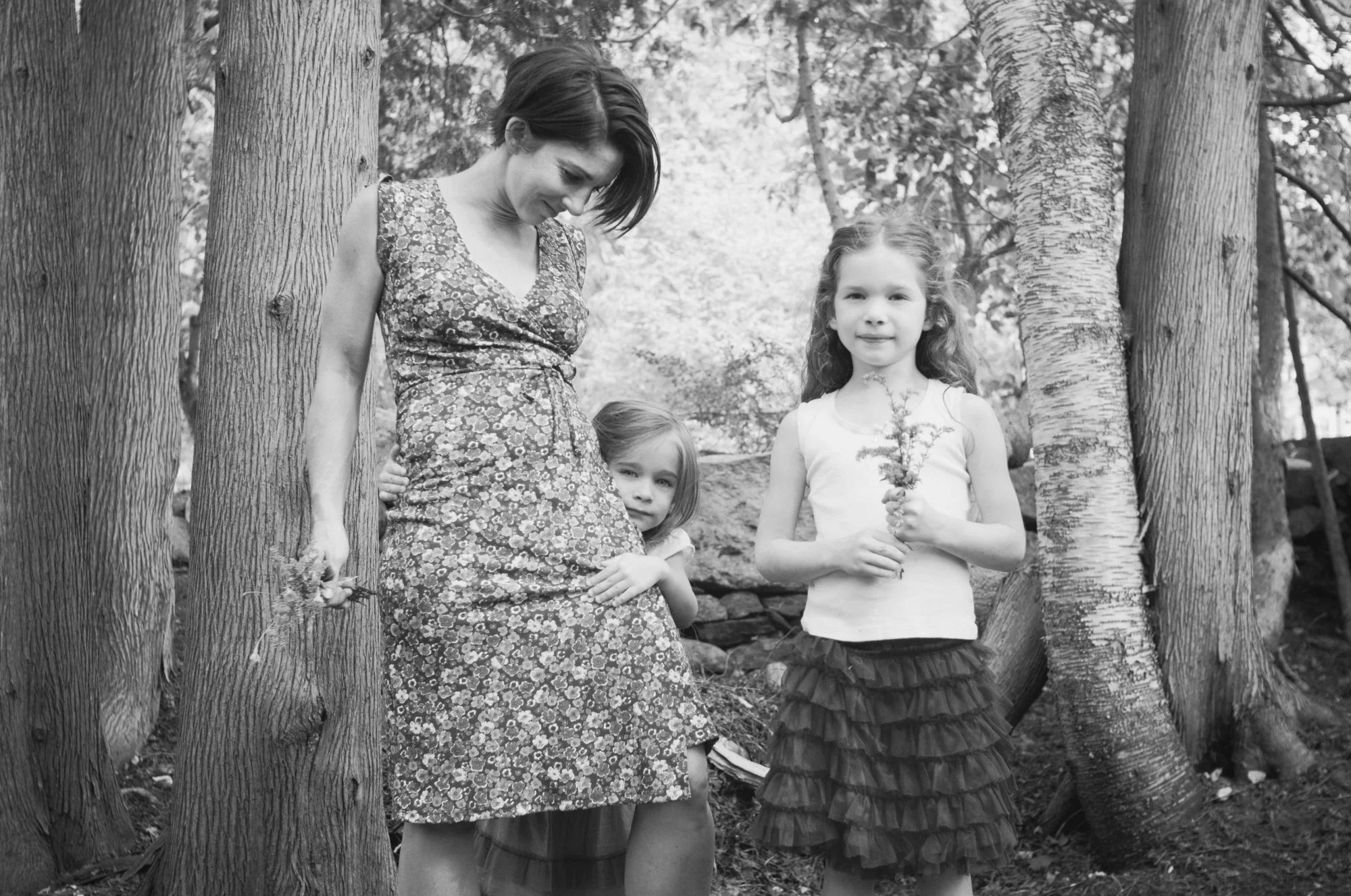 Black and white photo of mother and two daughers