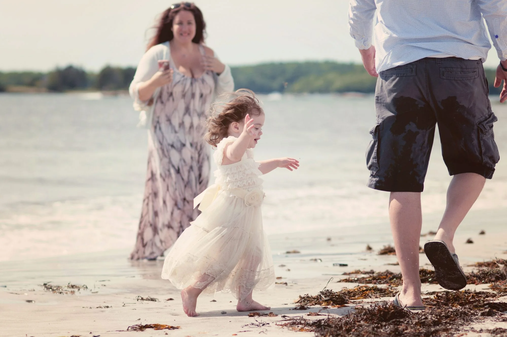 Little girl running at the beach in Pemaquid Maine