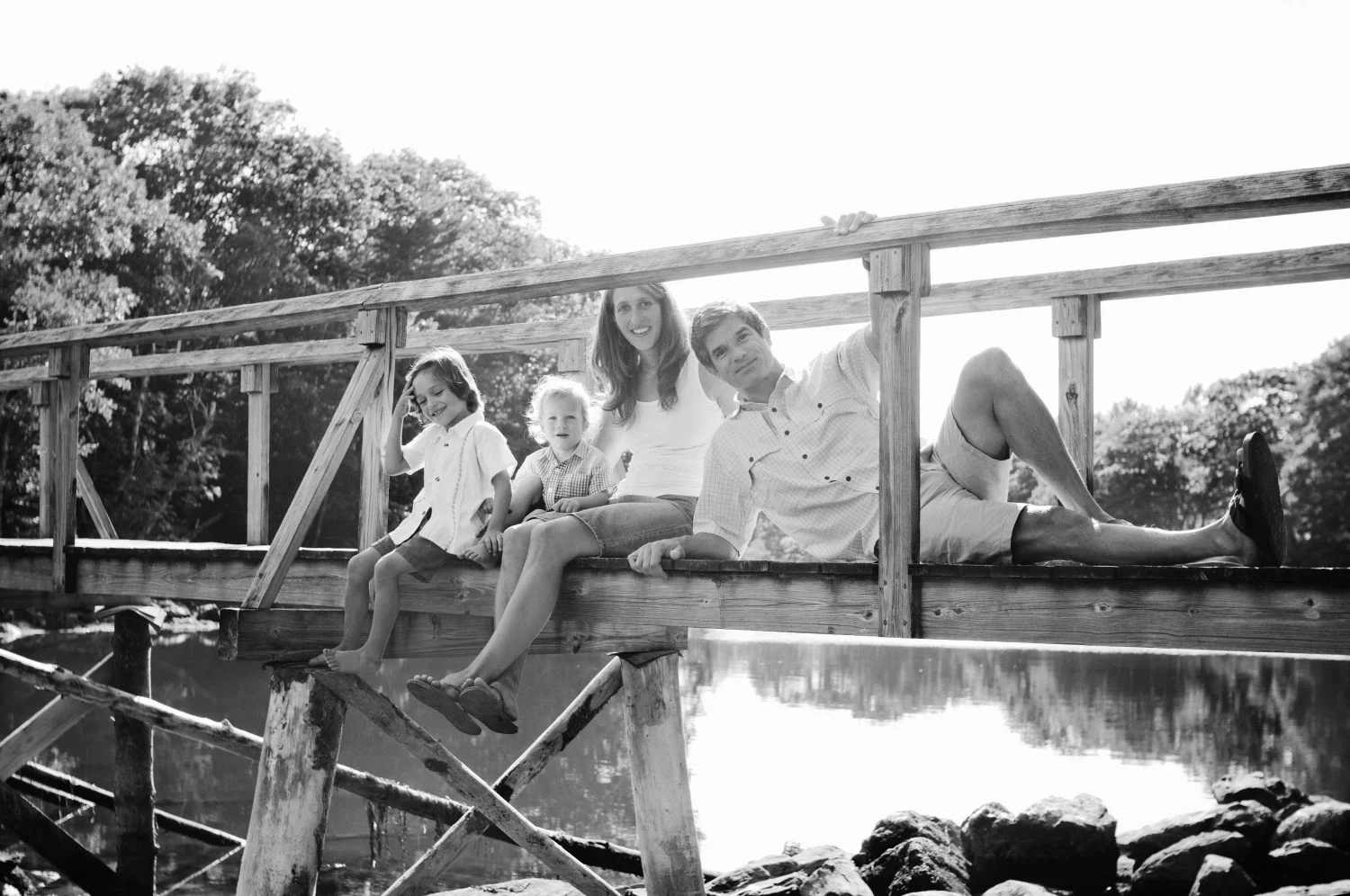 Black and White family photo taken on bridge at Back Cove, Maine