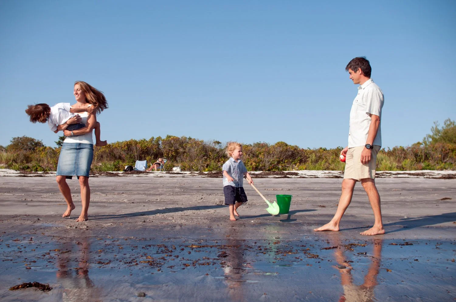 Family playing at Pemaquid Beach
