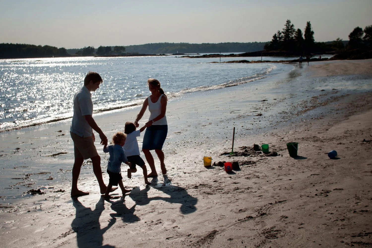 Family playing at the beach