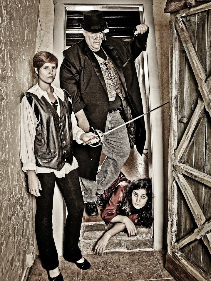 Laertes (Sarah Heddins), Polonius (Michael Raabe), and Ophelia (Clarity Welch)