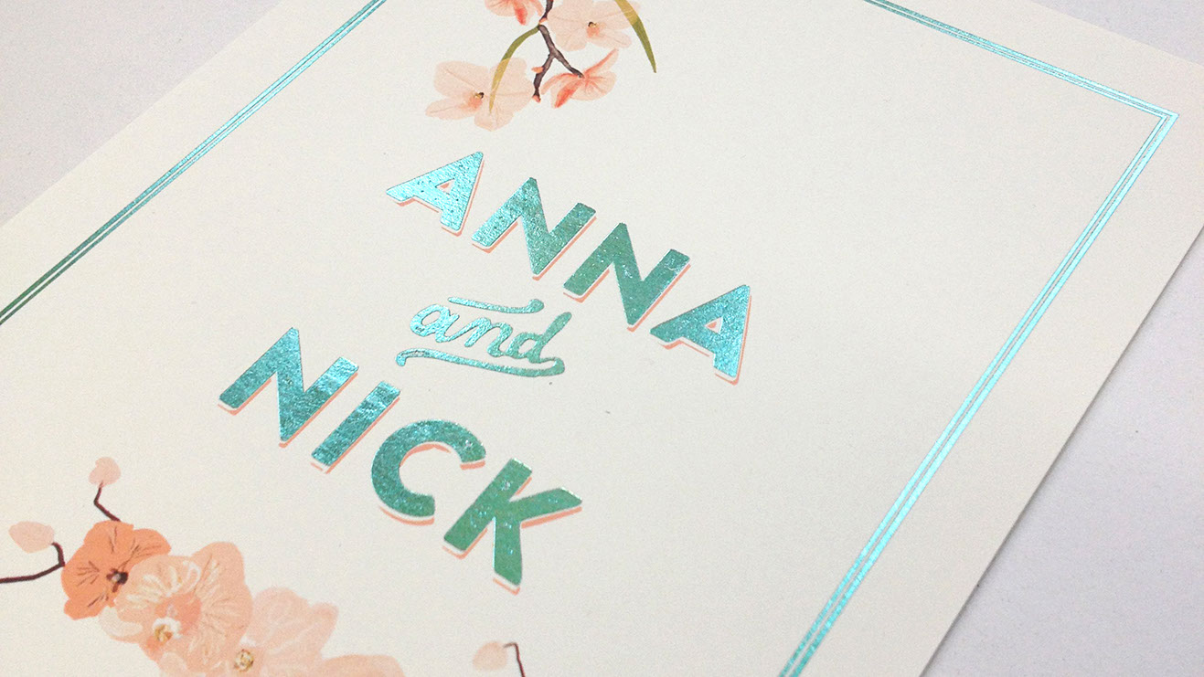 Floral wedding invitations with teal foil printed detailing