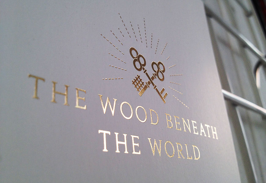 Gold foil printed event flyer for The Wood Beneath the World