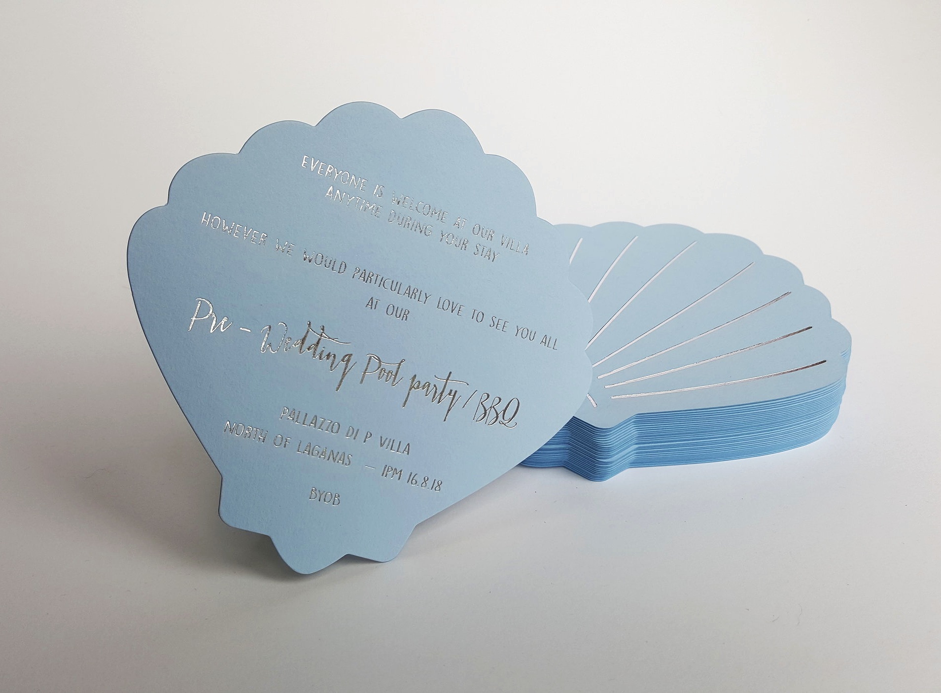 Bespoke die-cut shell silver wedding invitations