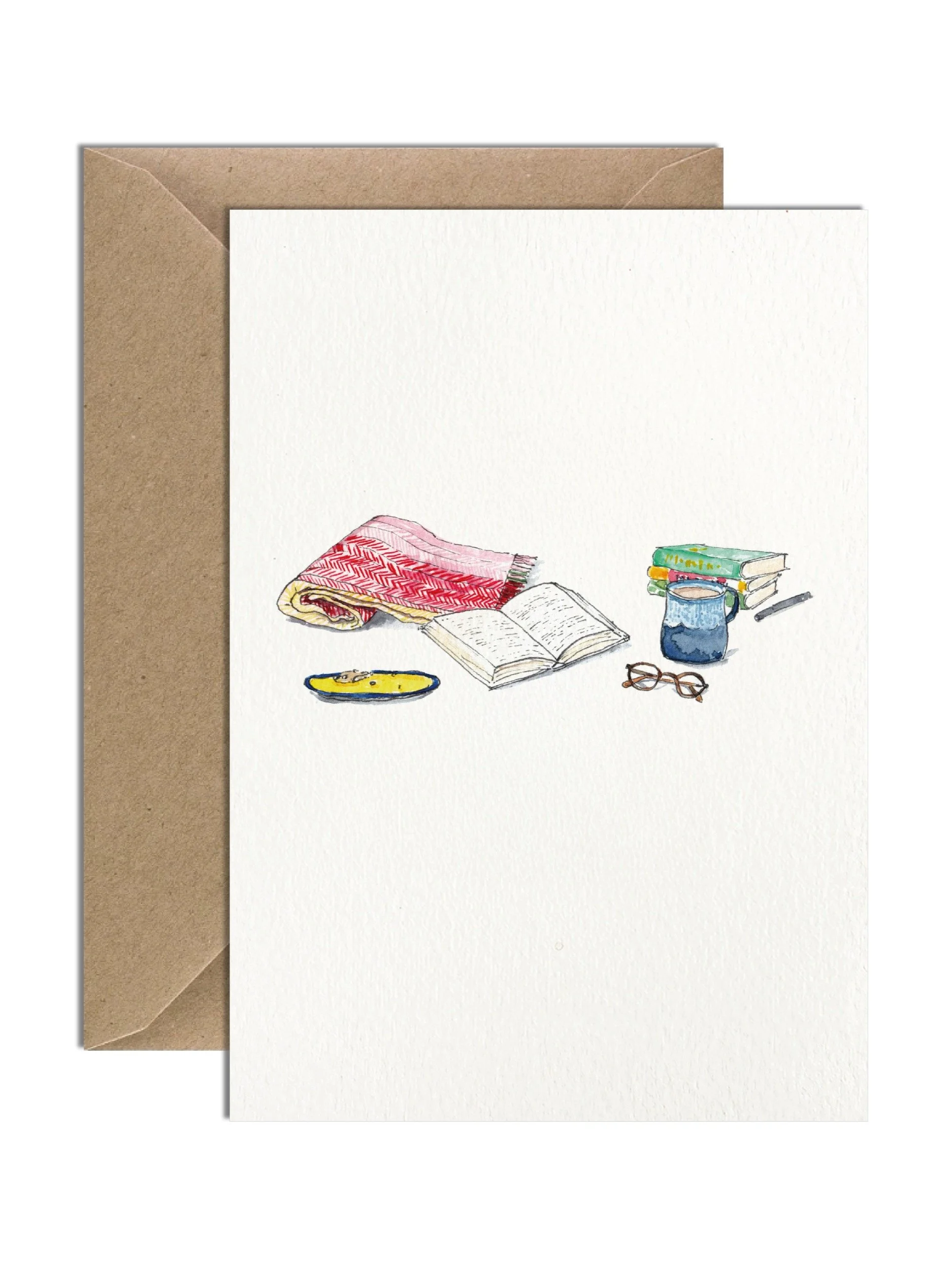 A delicate watercolour greetings card celebrating the love of books, with an illustration of a reading nook setup, shown against a white background.