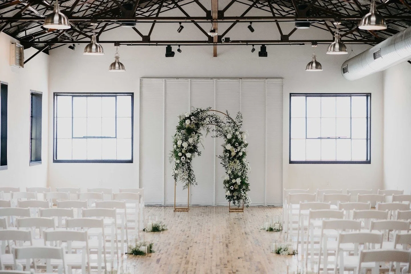 Where architecture, light, and atmosphere do the heavy lifting.  The Tinsmith is a wedding day backdrop that stuns!⁠
⁠
Planner: @redwoodweddingswi ⁠
Floral: @generationswfnp ⁠
Photographer: @eastelmphotography ⁠
Officiant: @koruceremony ⁠
Rentals: @a