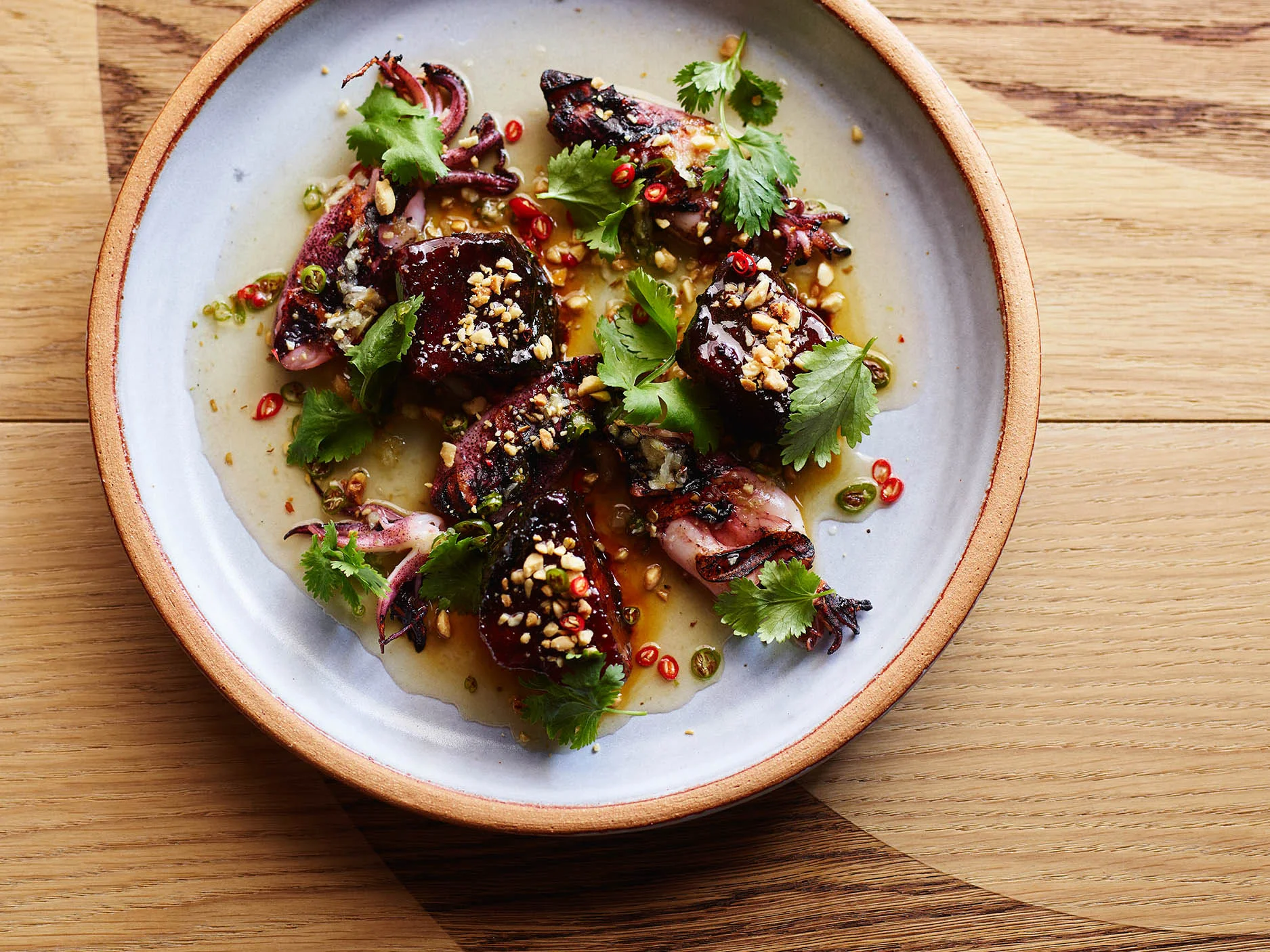 purple squid garnished with cilantro and peanuts.jpg