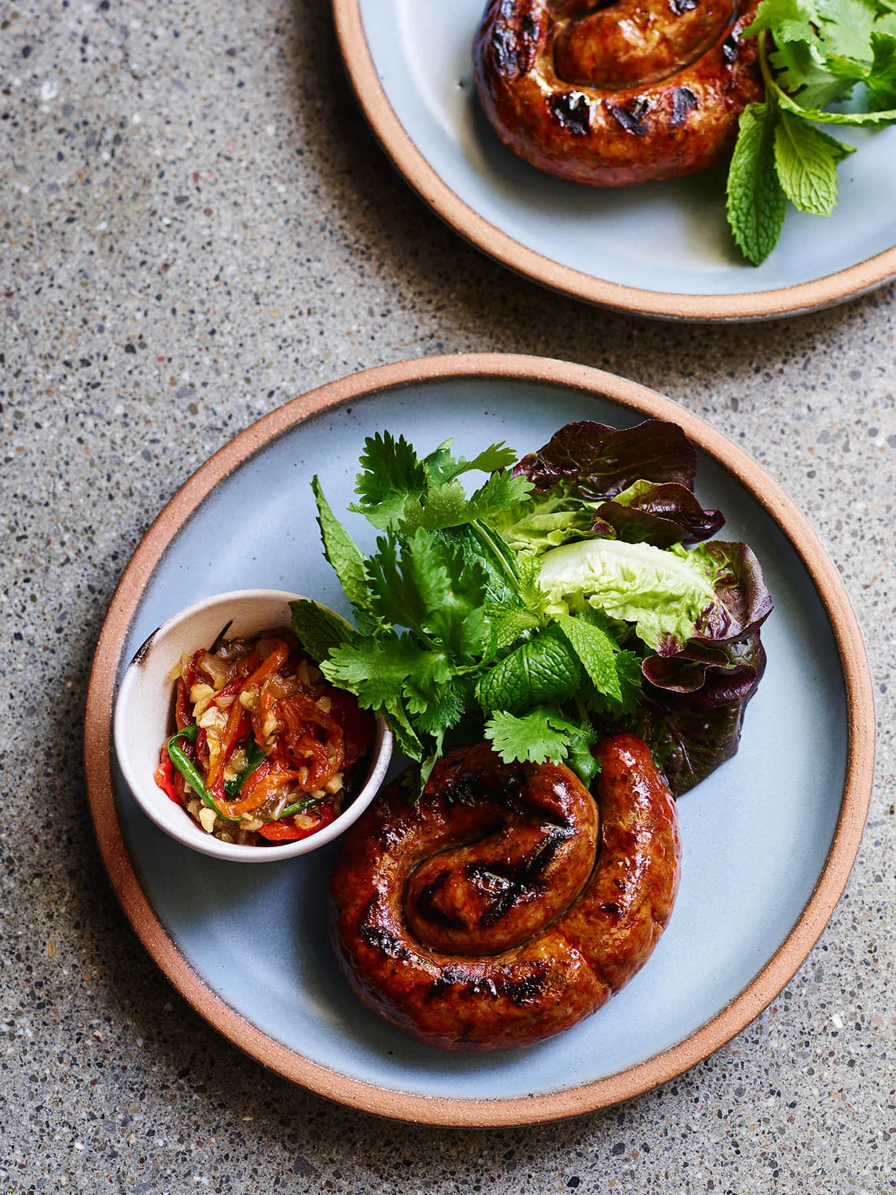 coiled-thai-sausage-on-sky-blue-plate.jpg