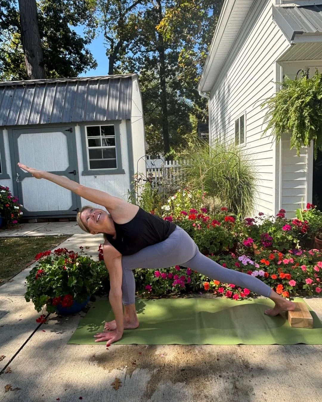 A few words from Mary: 
This is parivrtta parsvakonasana (revolved side angle pose) with a block under the back heel for support. The classic pose is done with the outer rim of the back foot down. I&rsquo;ve lifted it to facilitate the turning of the