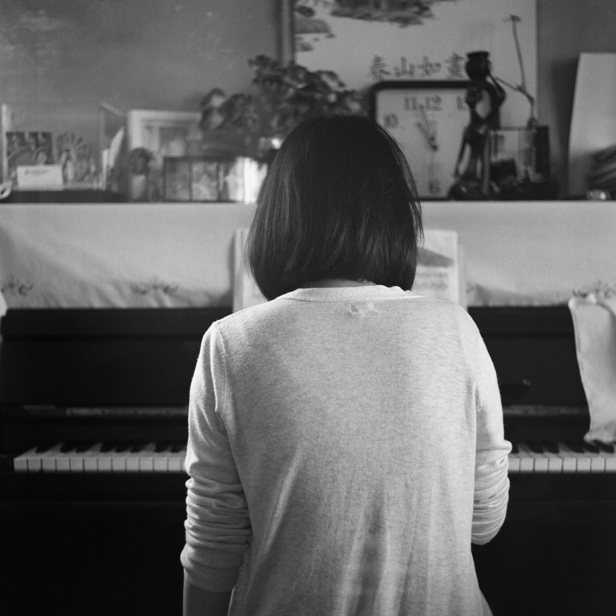 China BW Playing the piano back web.jpg