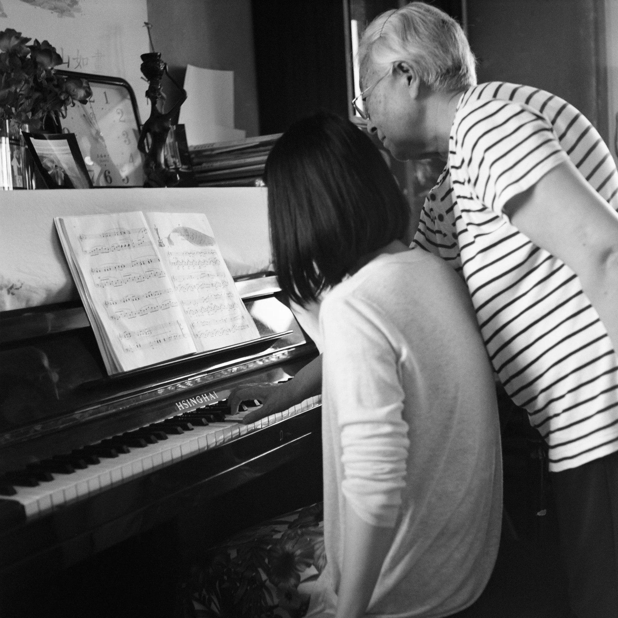 China BW Grandma teaches piano web.jpg