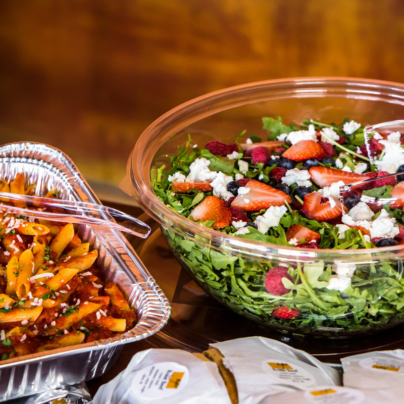 catering dishes with salad and pasta