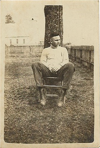 guy leaning back in chair.png
