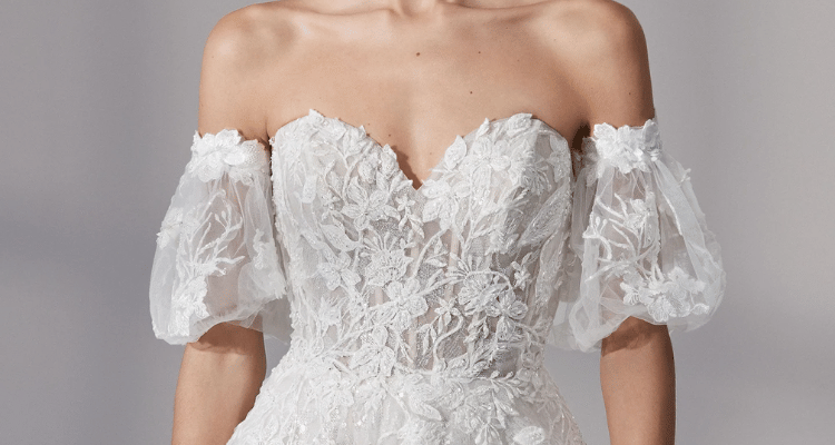 A bridal gown with sweetheart neckline and puff sleeves