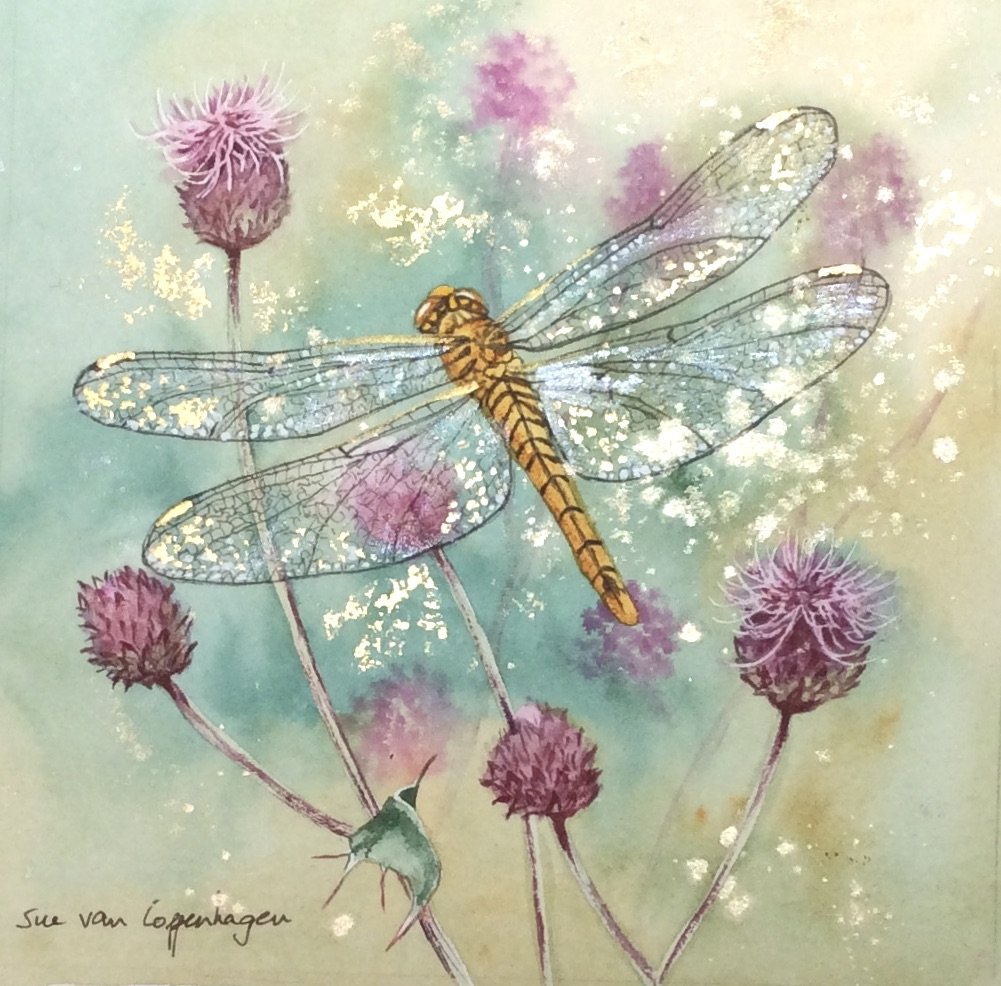 Painting of a golden dragonfly shimmering with gold paint and genuine gold leaf over pink thistle flowers