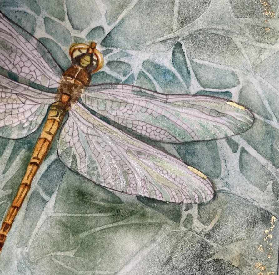 Detail of a dragonfly painting showing the shimmer and gold leaf on the wings