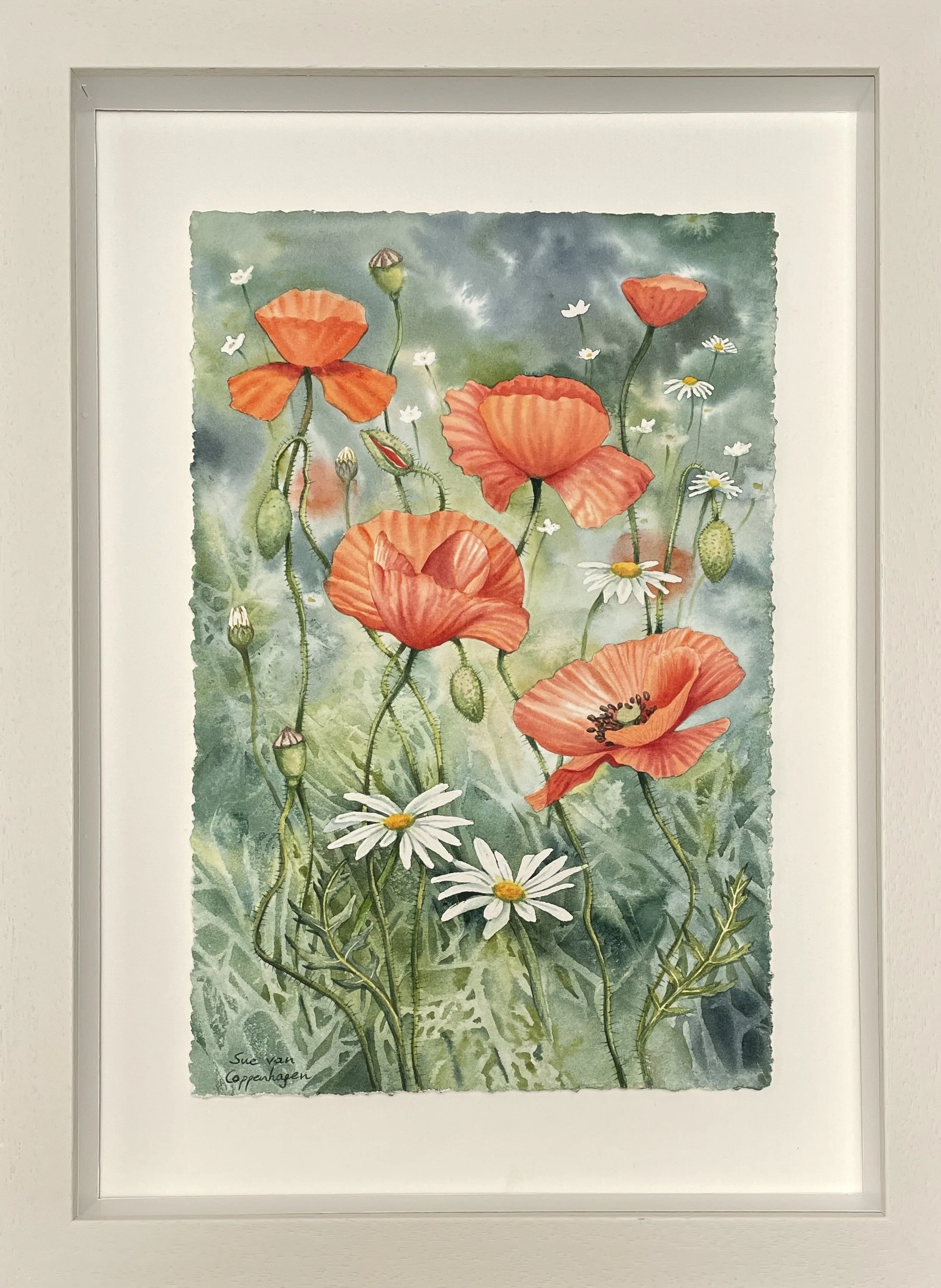 Painting of red poppies and white daisies on a green, leafy background, in an off-white wooden frame