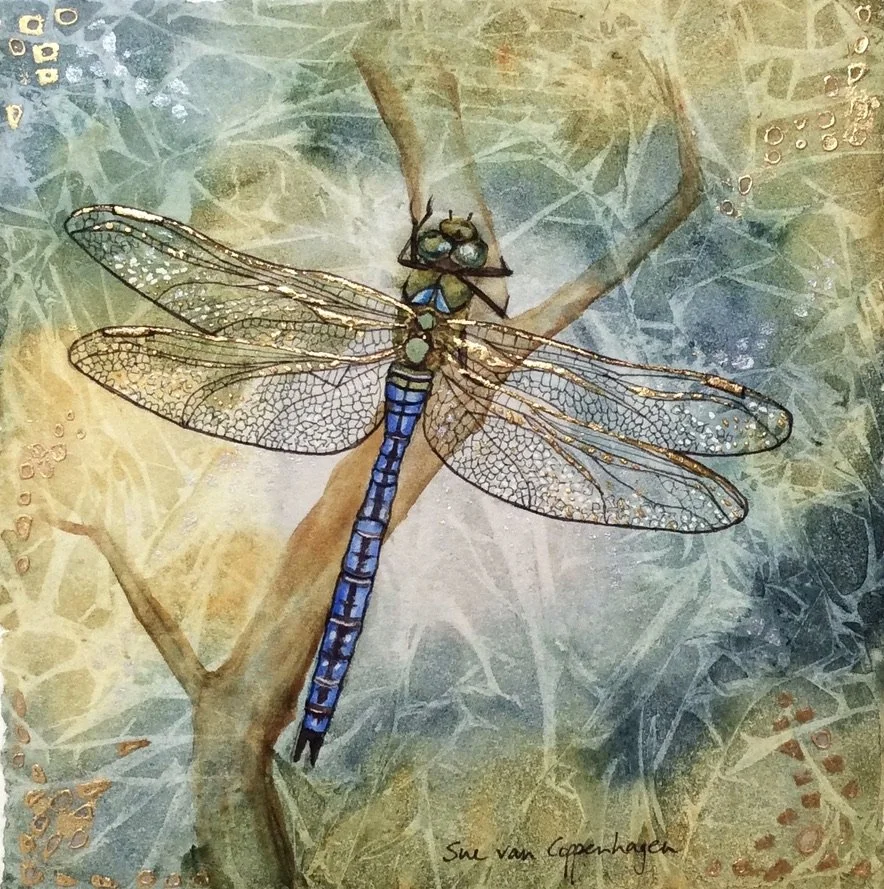Painting of an Emperor dragonfly with a blue body, perched on a branch, against an abstract background in blues and golds with touches of gold leaf applied