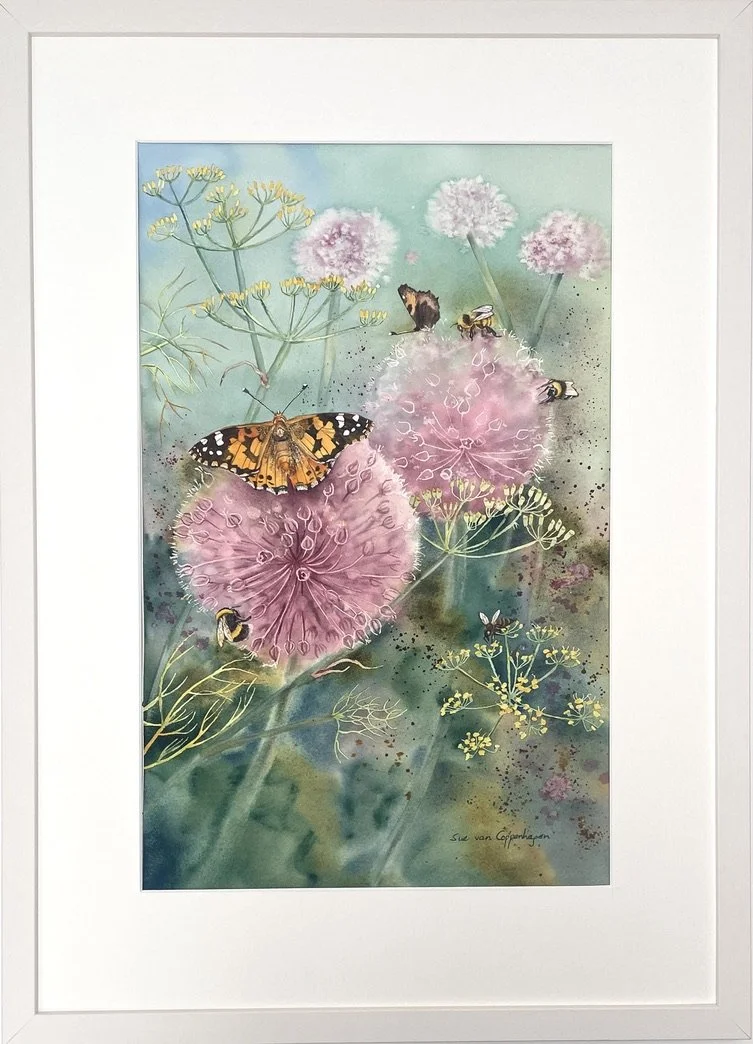 Framed painting of pink allium flowers, butterflies and bees on a soft green background