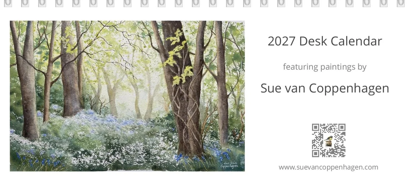 Front cover of calendar with a painting of a Spring woodland scene featuring bluebell flowers and wild garlic
