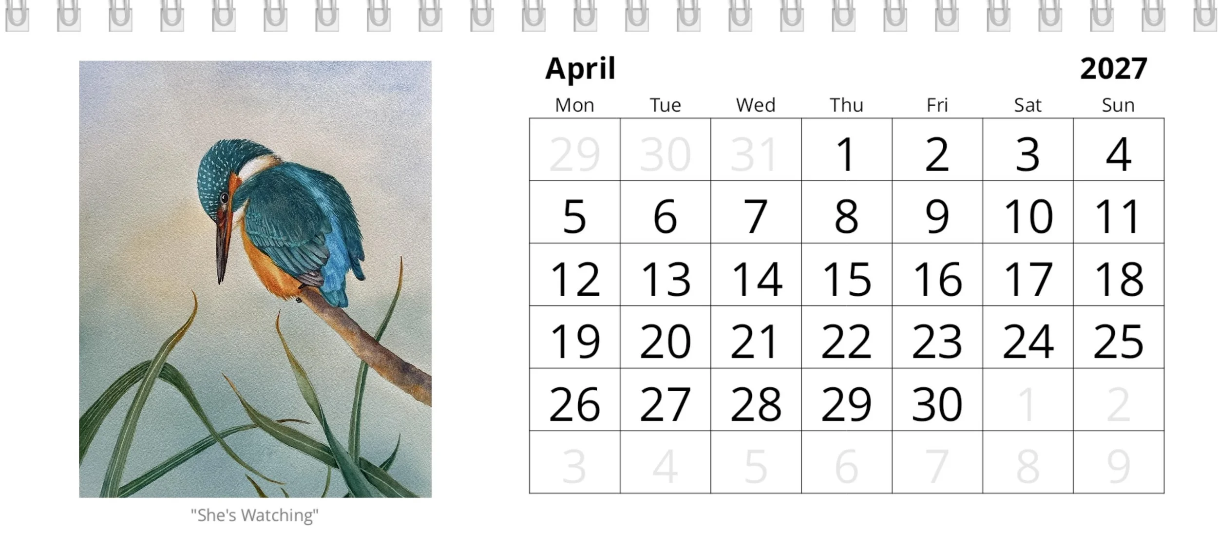 April calendar page with dates and a painting of an Irish kingfisher bird perched on a branch above reeds