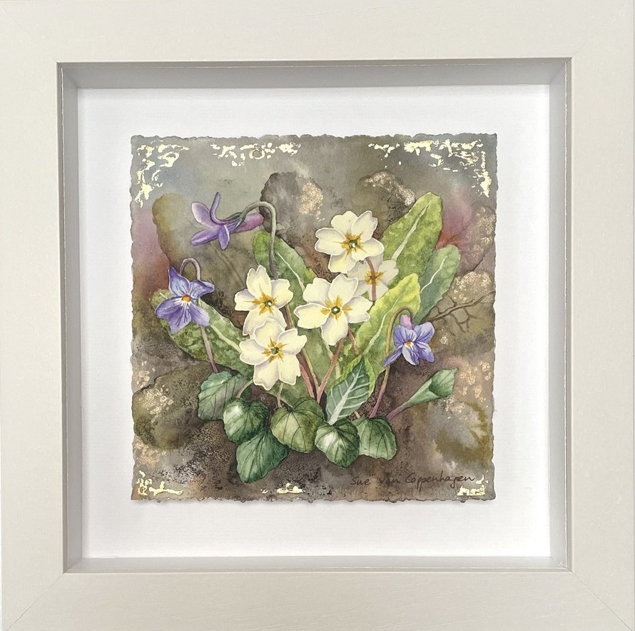 Painting of primrose and violet flowers and leaves on a grey to brown background with touches of blue and pink, edged with gold leaf and framed in an off-white square frame