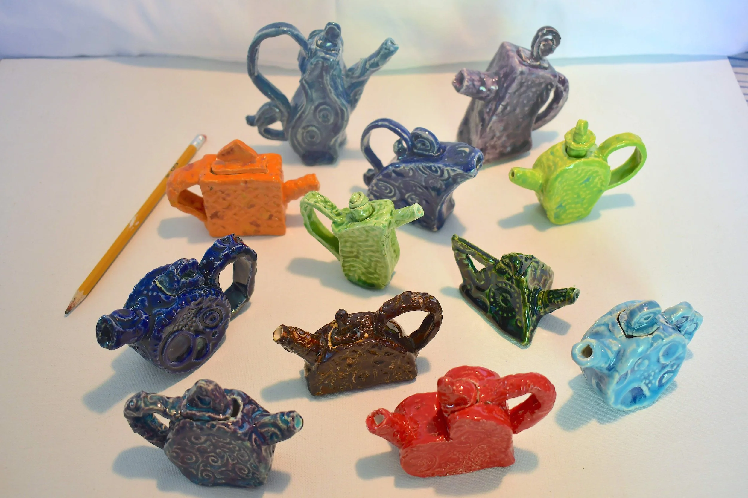 weissman mini teapots (low res) w pencil for scale copy.jpg