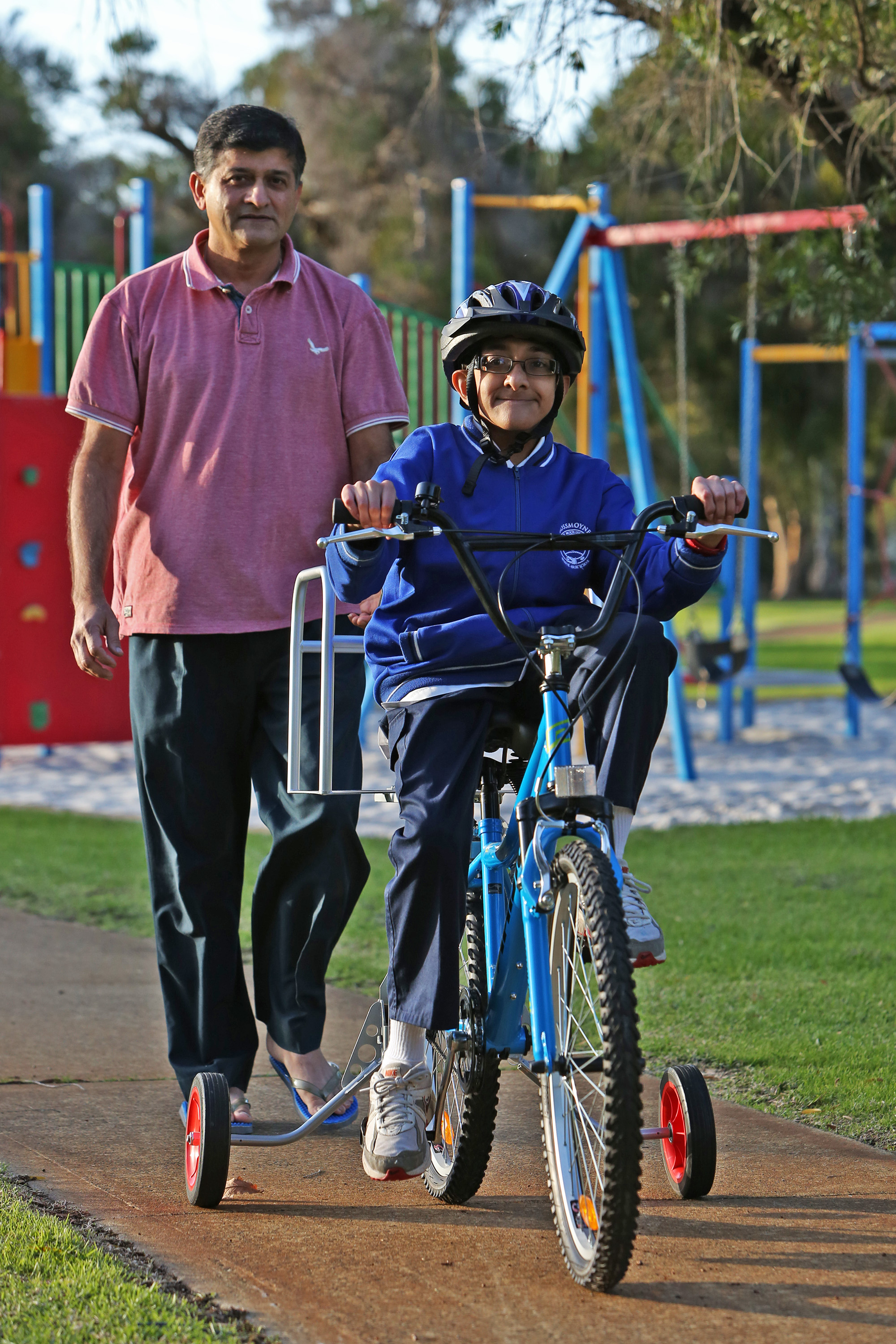 boy with disability riding modified bike