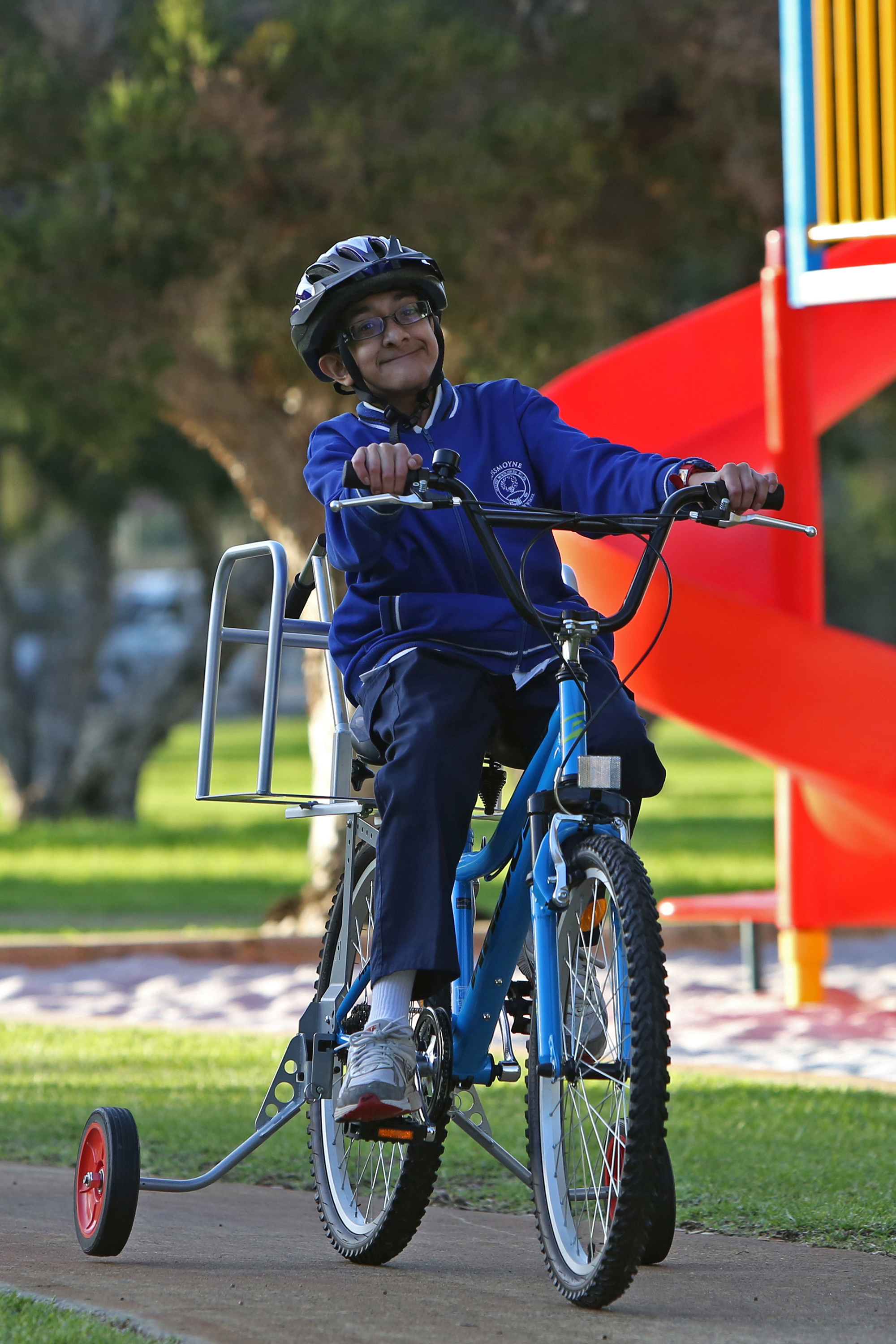 boy with disability riding modified bike