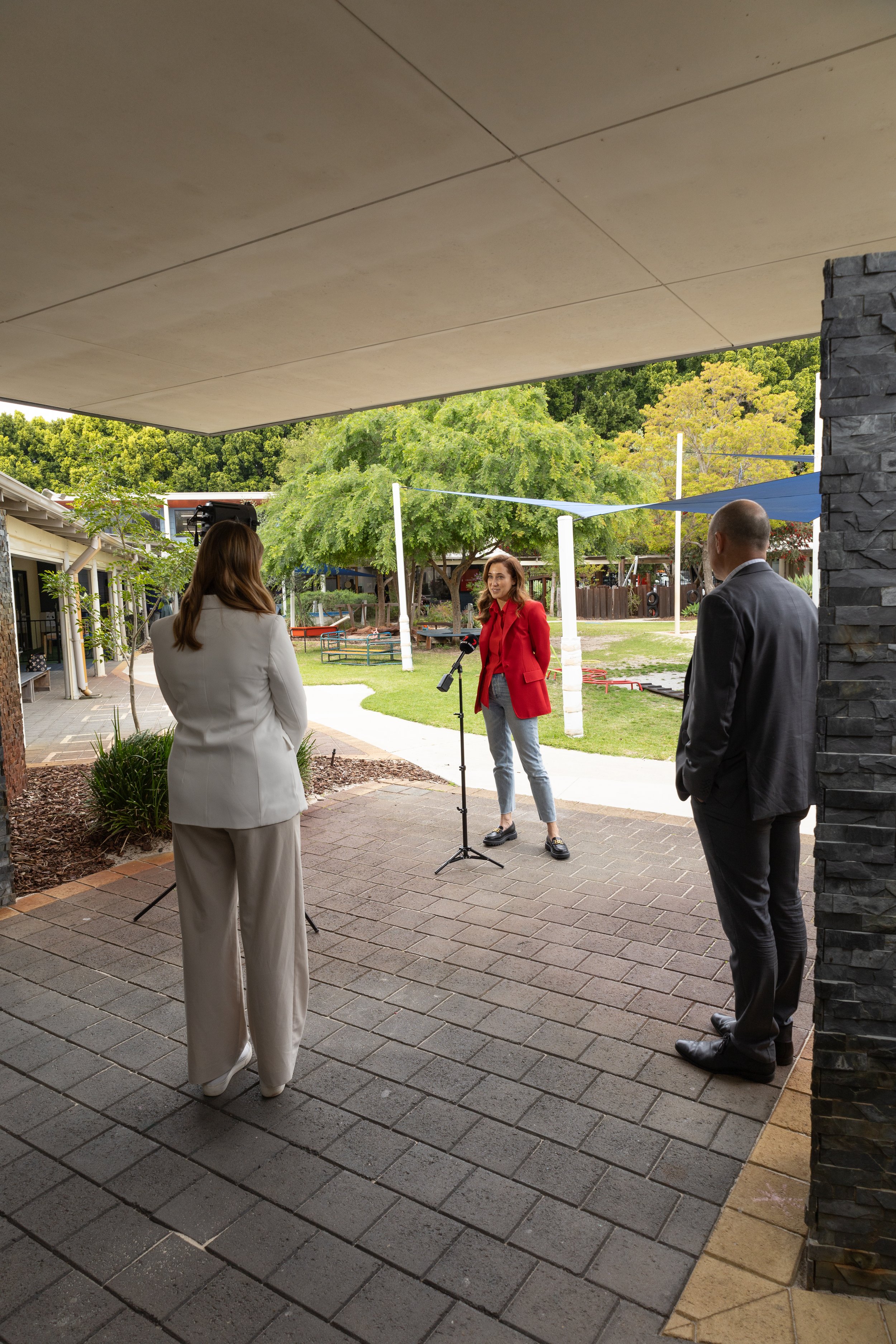 woman being interviewed by a tv news crew