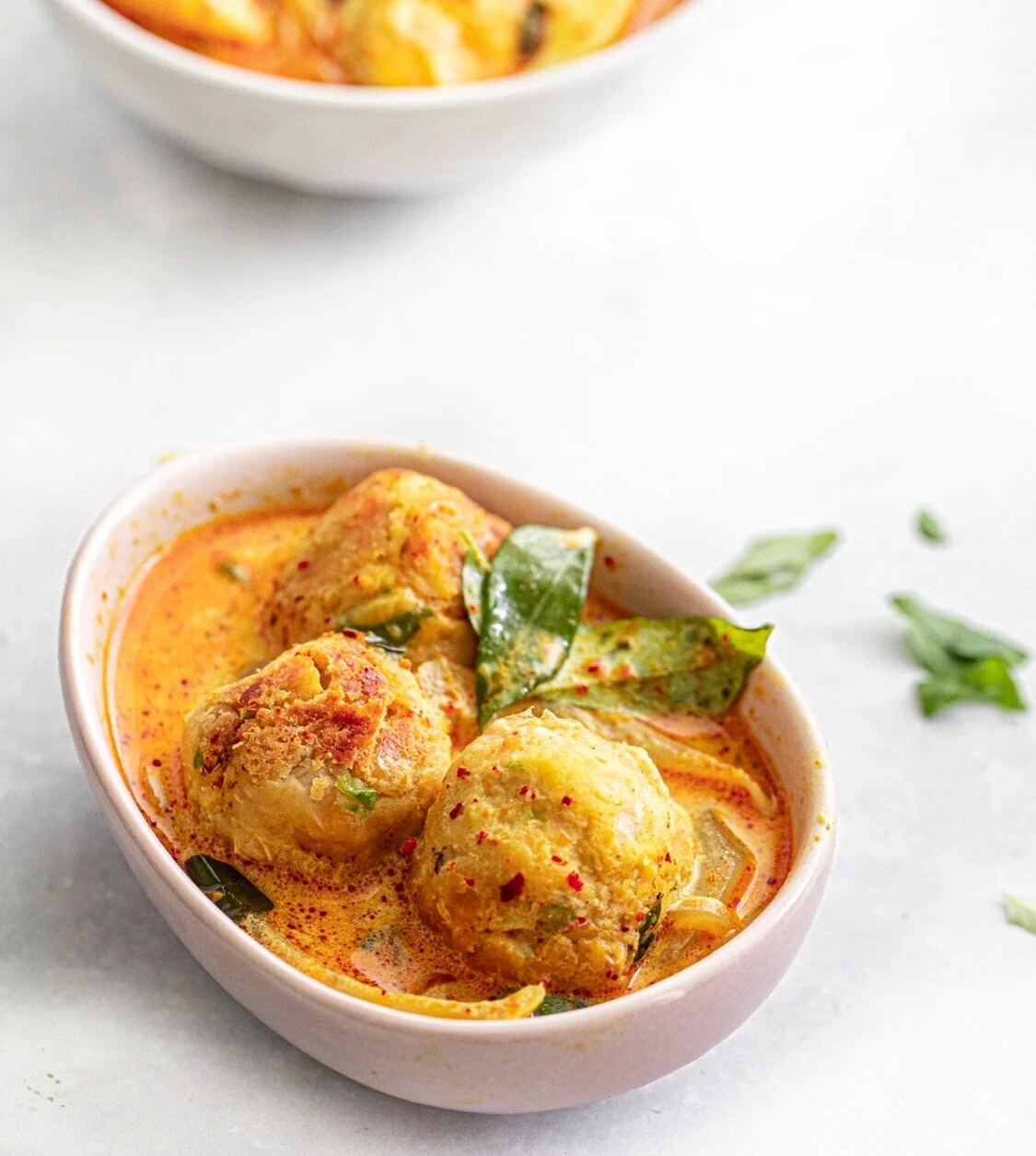 vegan meatballs in a curry sauce