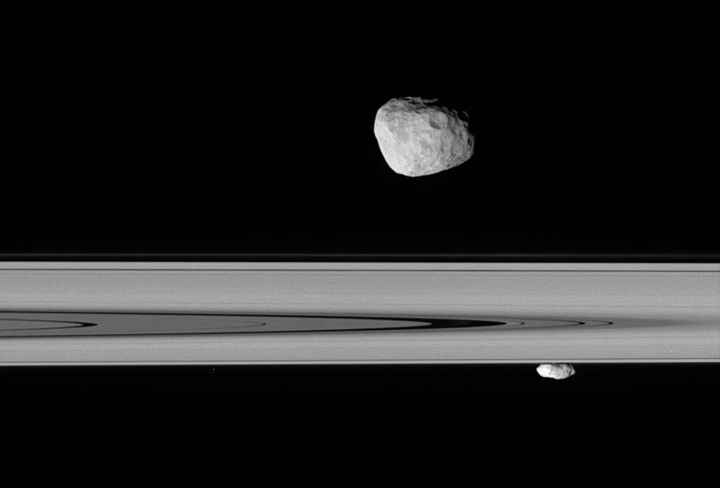 Saturn's_moons_Janus_and_Prometheus_PIA08192_(NASA).jpg