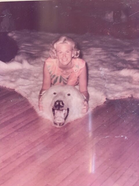 My mom, Anne Keresey on a bear rug in the Lodge. The same rug is now on the wall in the Lodge