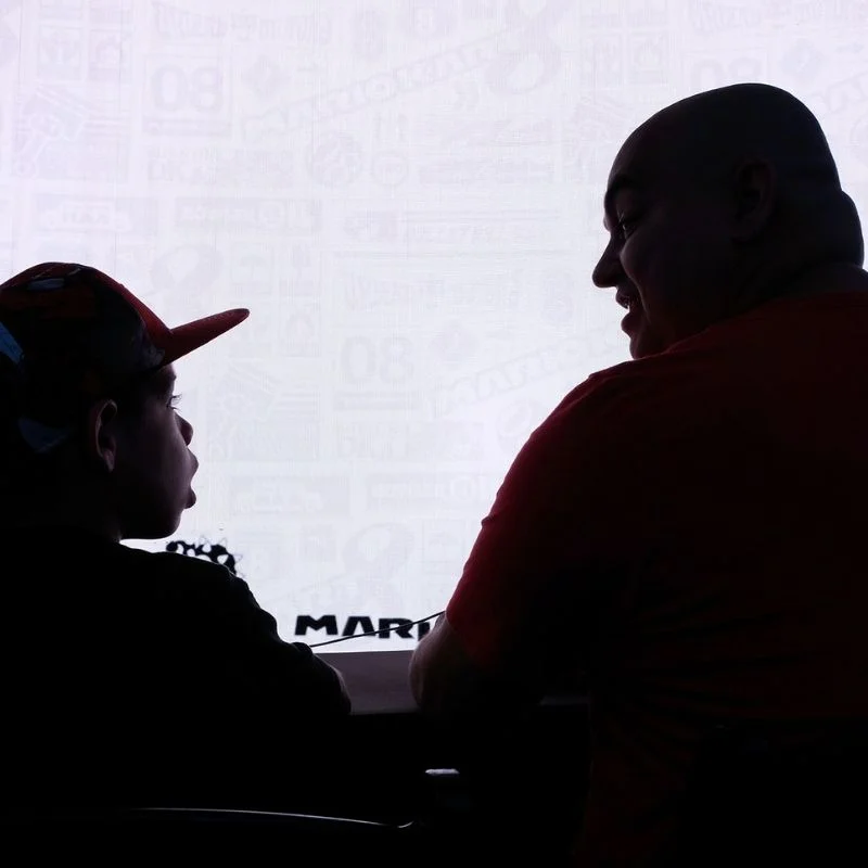 Father and Son Team Playing Mario Kart 8 Deluxe at a Bravous Esports Showcase