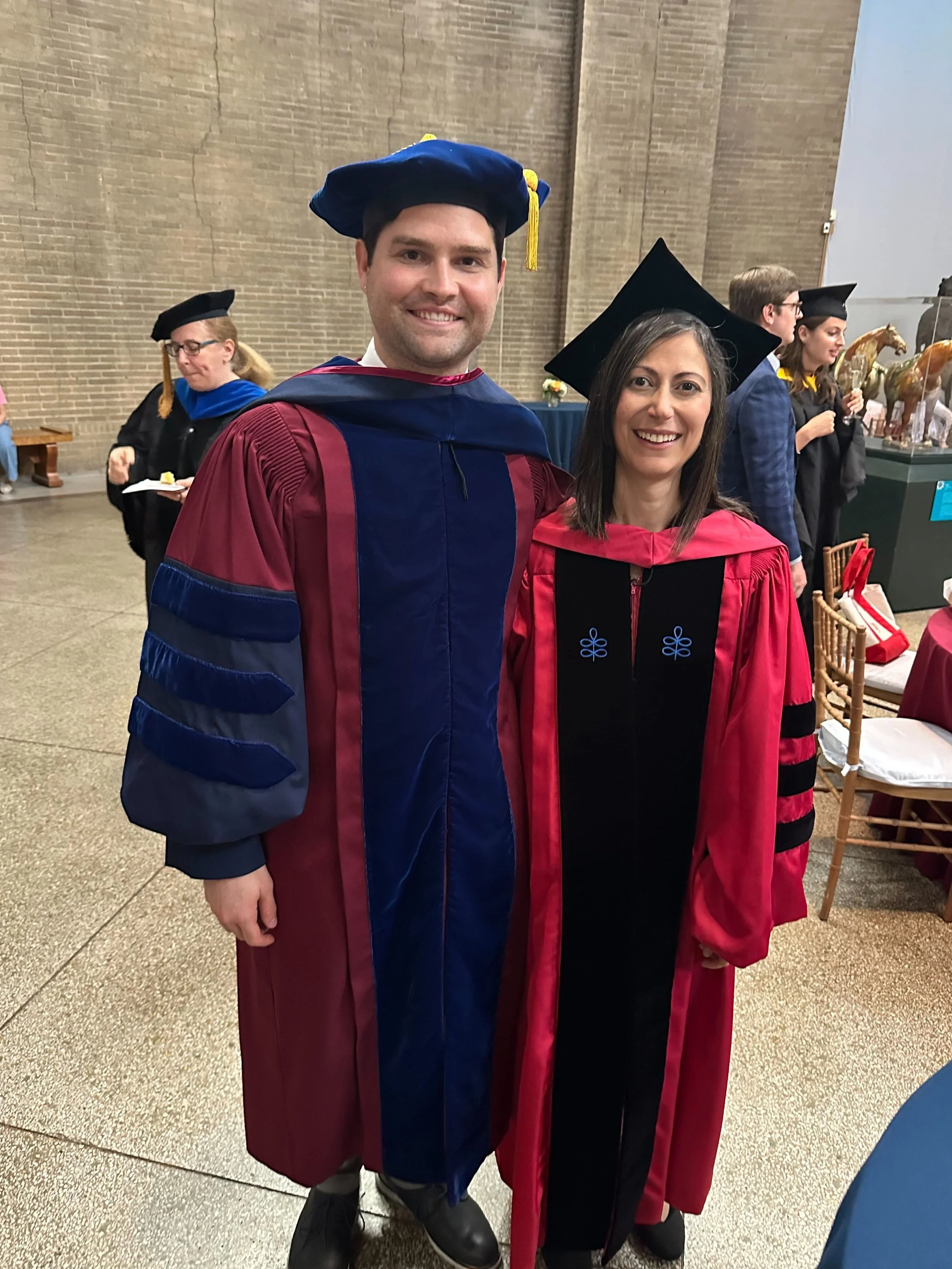 Proud PI hooding Charlie at 2025 commencement