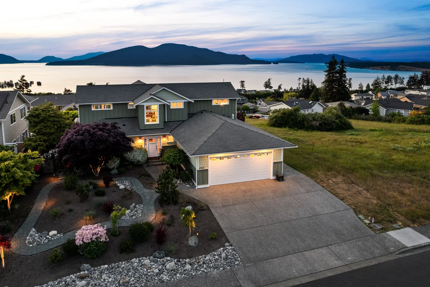 Aerial of Anacortes Home with Island View During Sunset Twilight