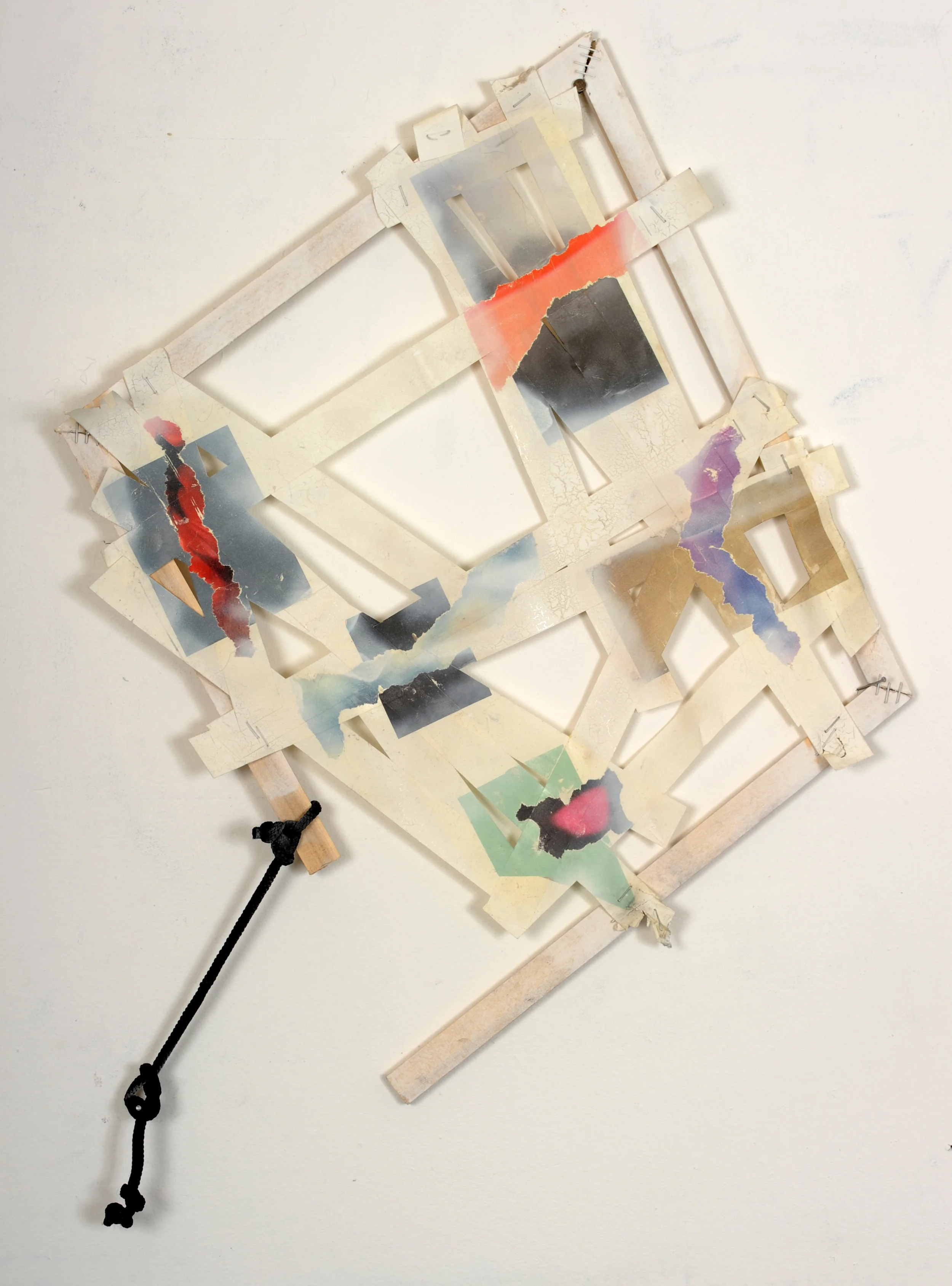 After Tape , 2010 Magazine transferred to tape, wood, staples, bag handle 19 x 20 inches