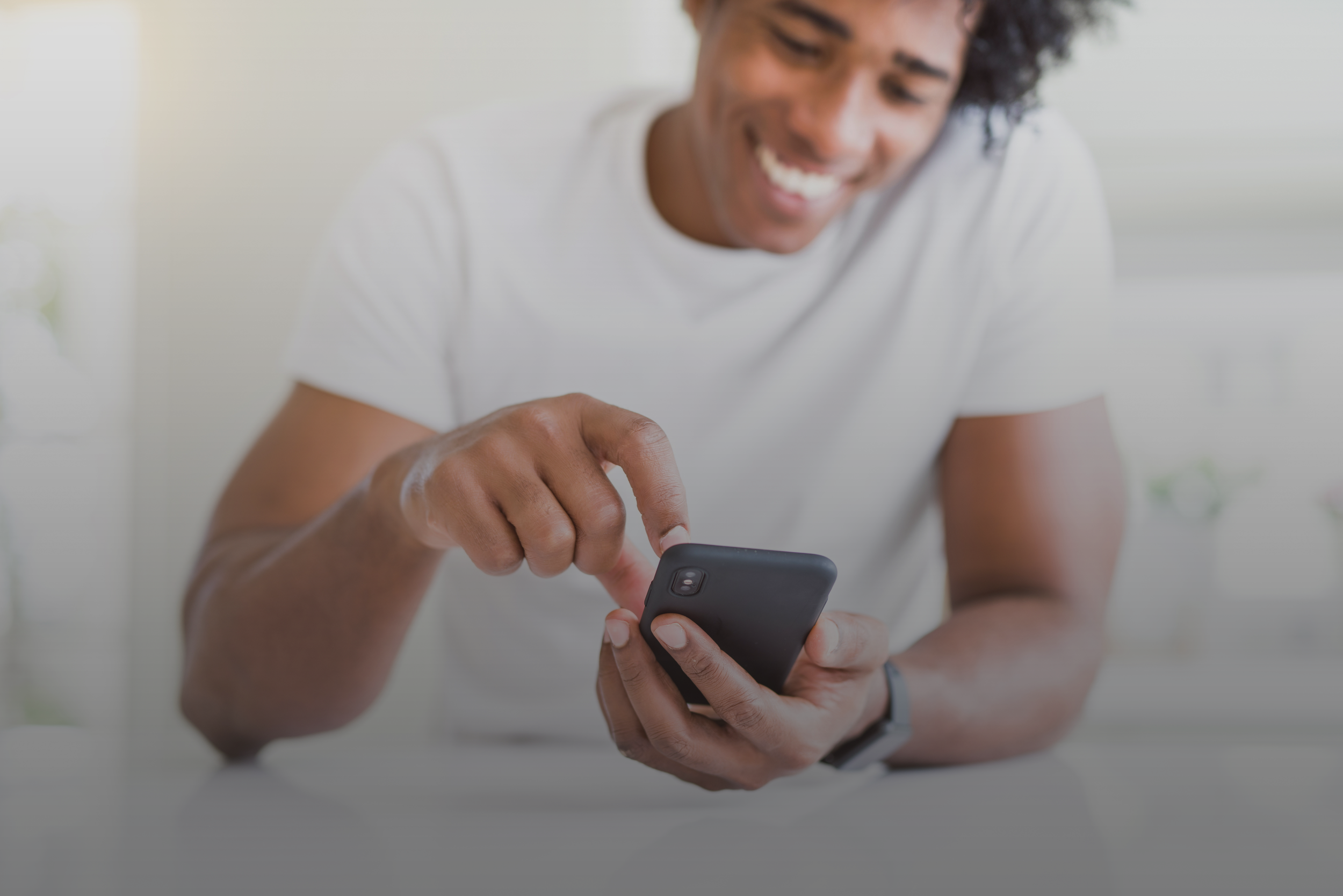Man in White Shirt Using iPhone Gradient.png