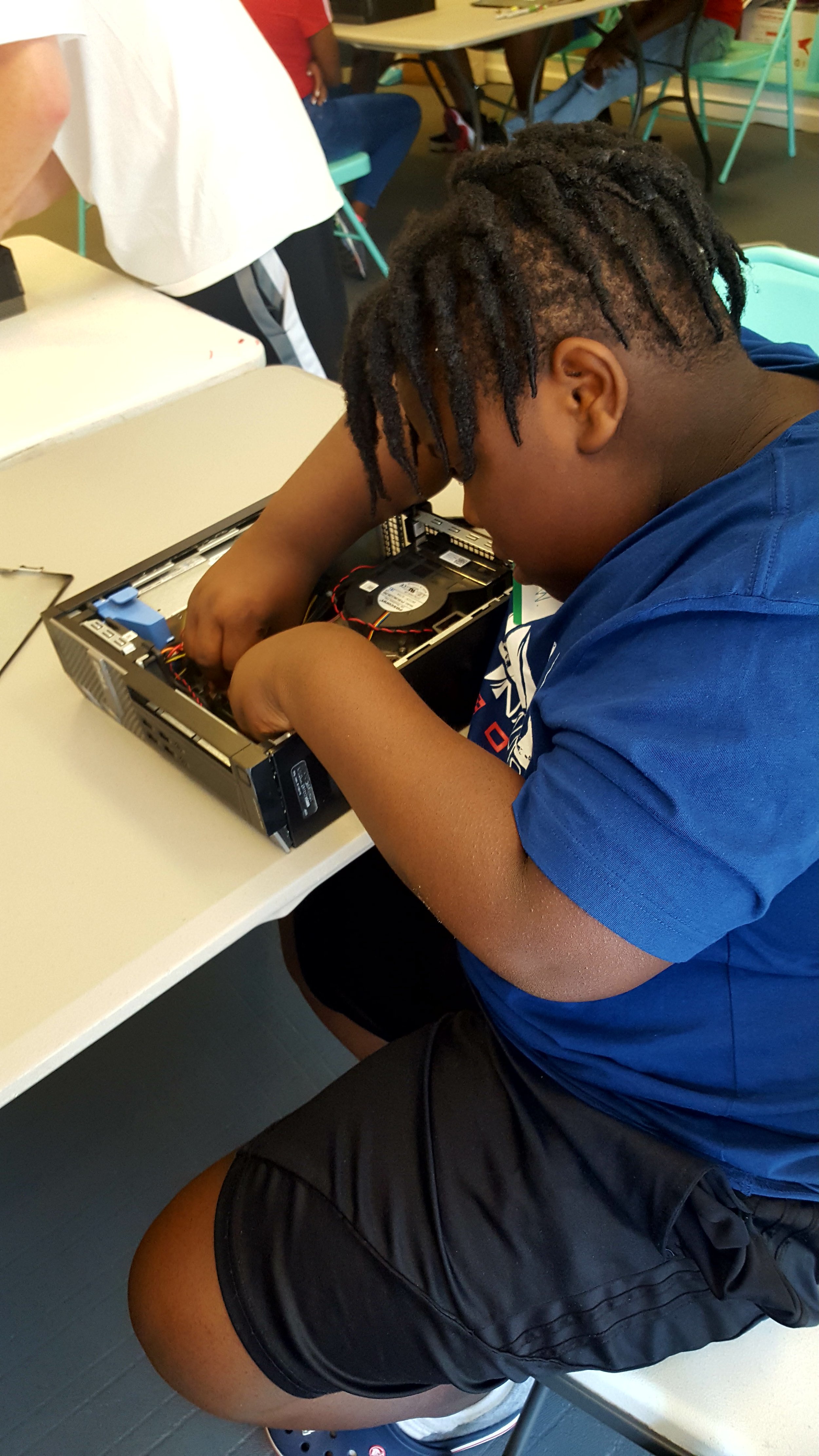 Student with Open Computer Case at Computer Building Camp