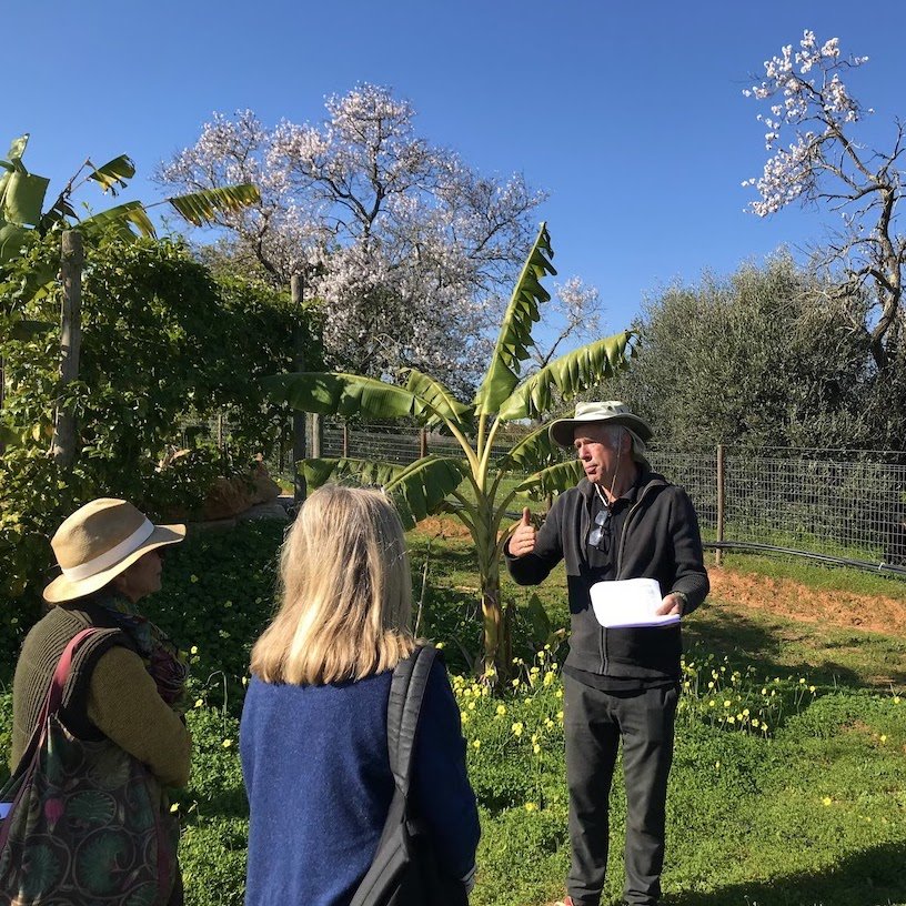 Miguel Cotton giving a tour of the Orchard