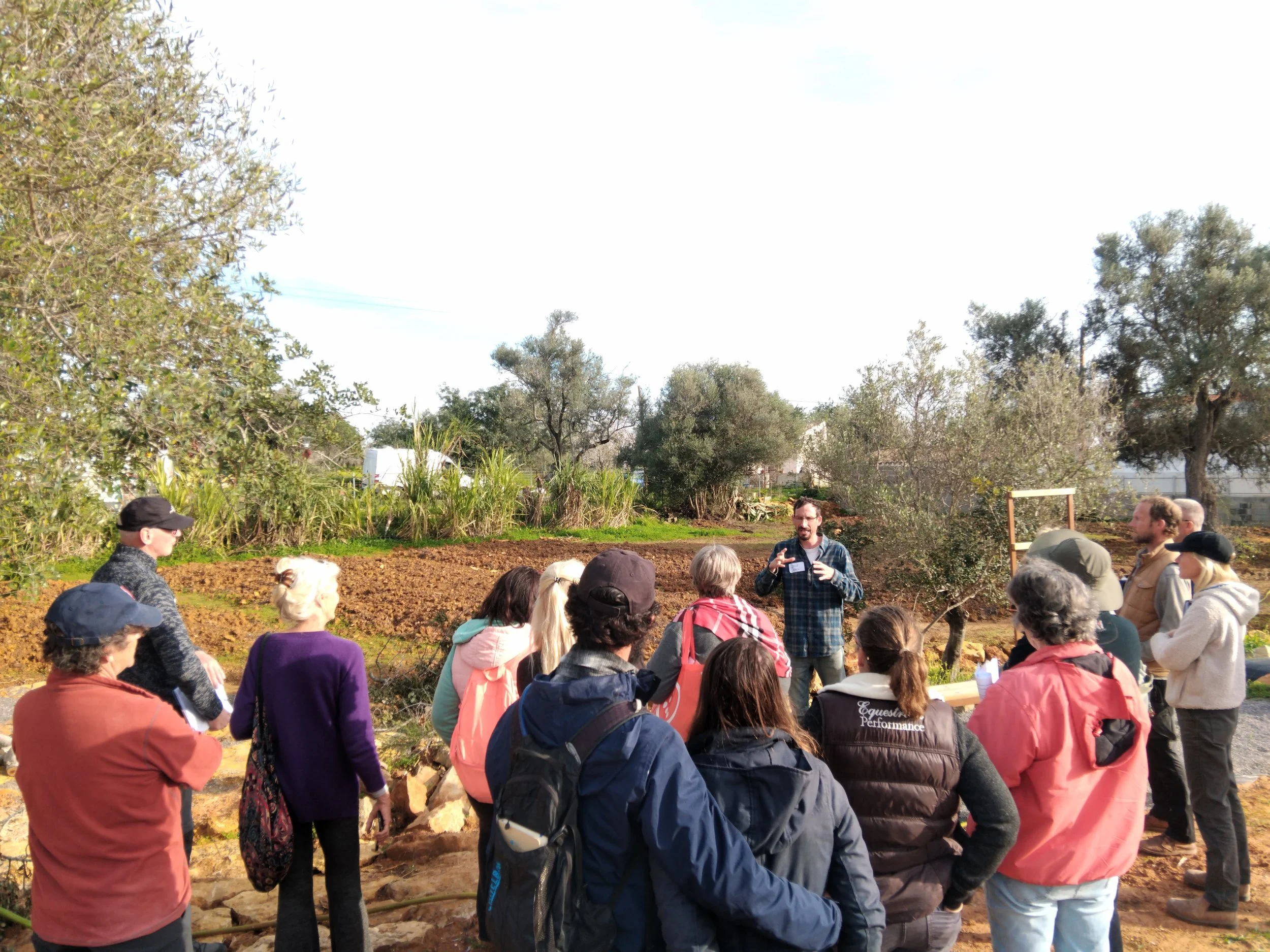 Dror Avital (plant biologist) explaining the Dry Orchard Experiment concept to Orchard visitors