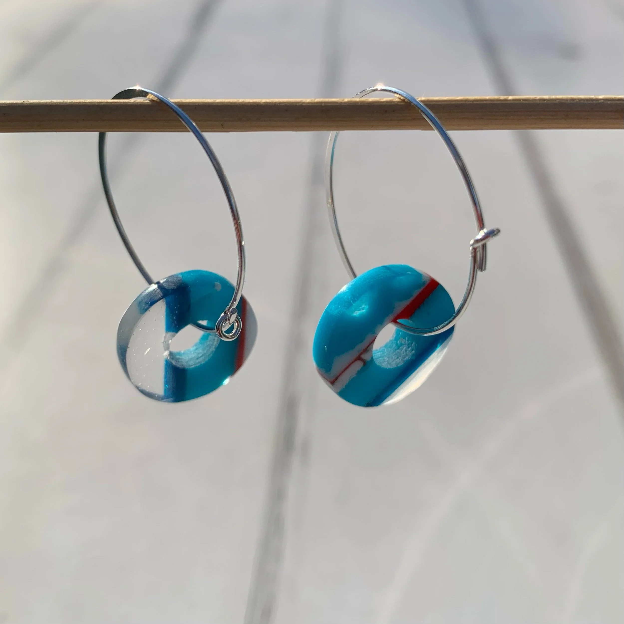 Small recycled resin spinner earrings by resin artist Fiona Scott
