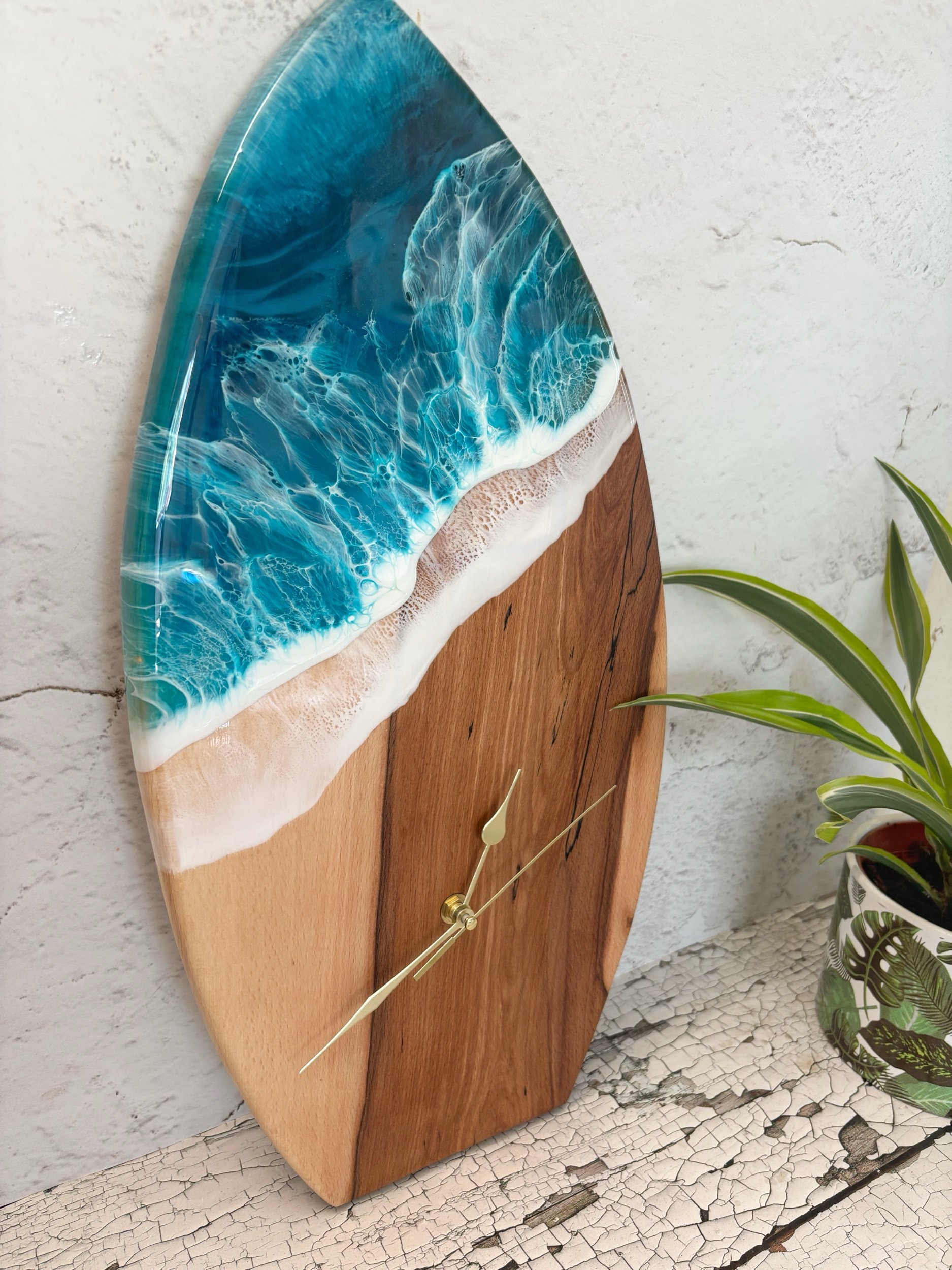 large handmade wooden clock in surf board shape with ocean inspired resin