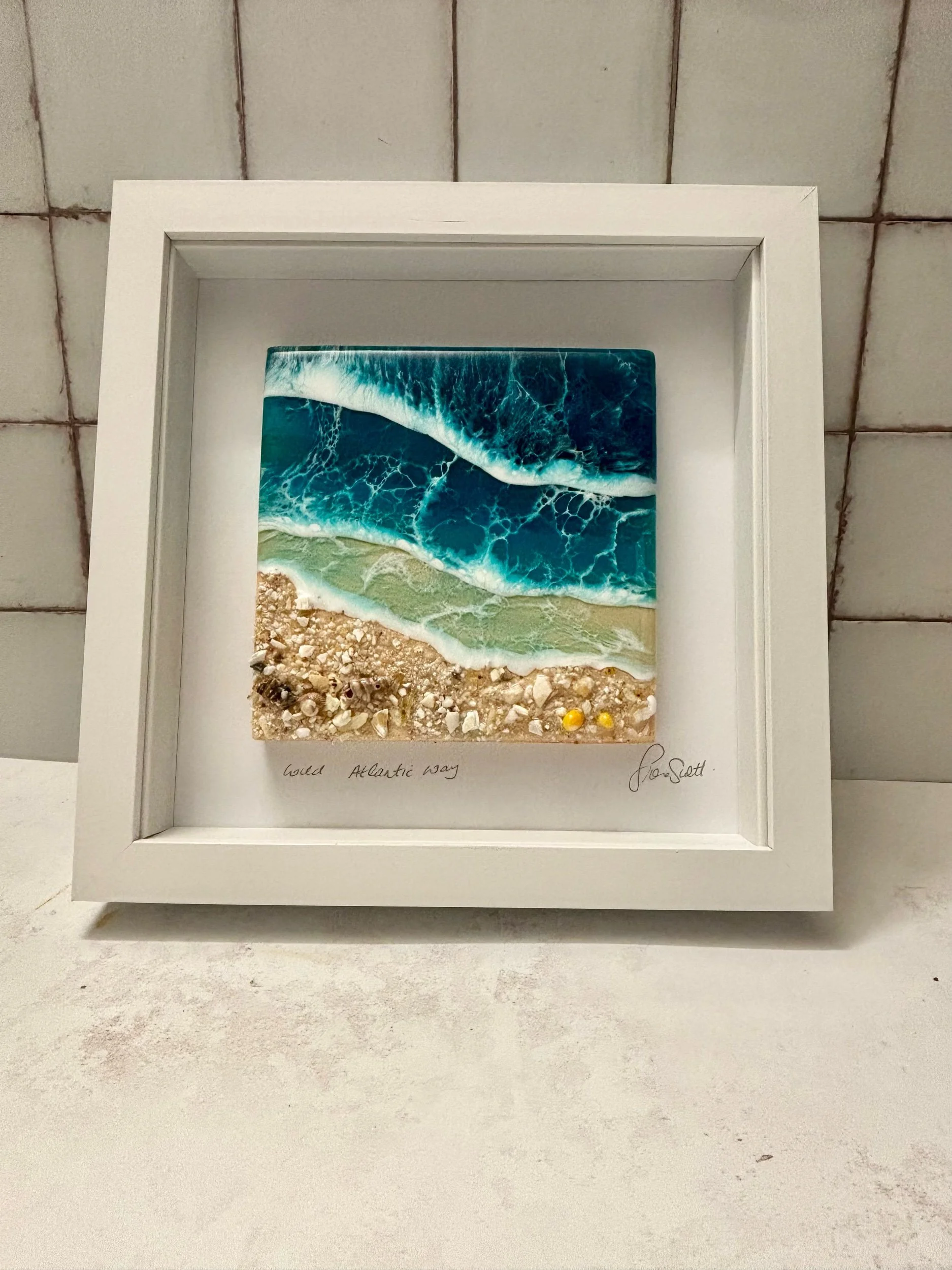 Handcrafted ocean resin wall art inspired by the wild atlantic way. framed costal beach artwork with realistic waves and shell detail. Perfect for modern coastal home decor