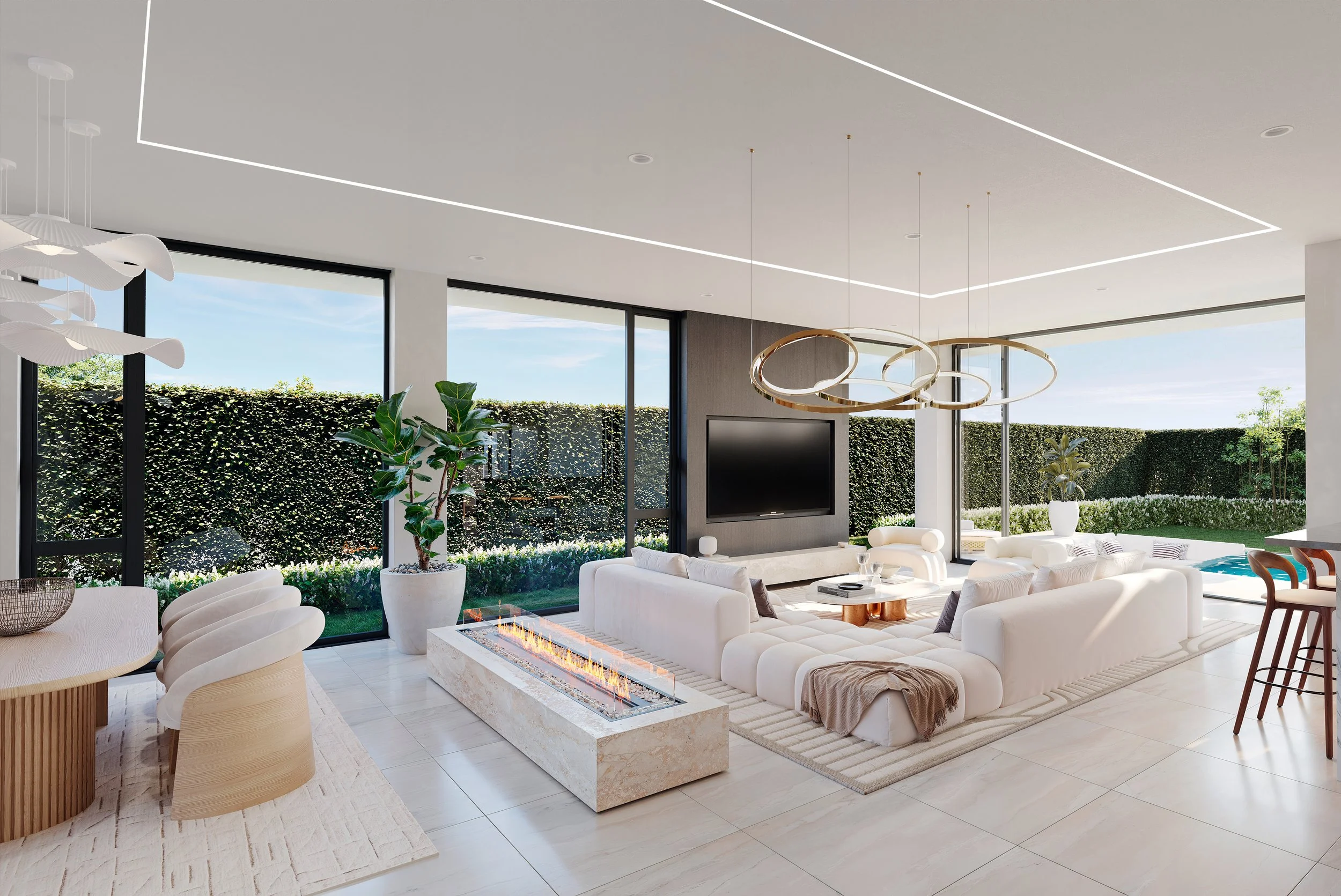 Ladbroke Lane: Modern open-plan living room with white sectional sofa, gas fireplace, large floor-to-ceiling windows, and minimalistic lighting fixtures, overlooking a garden with a hedge, trees, and a pool.