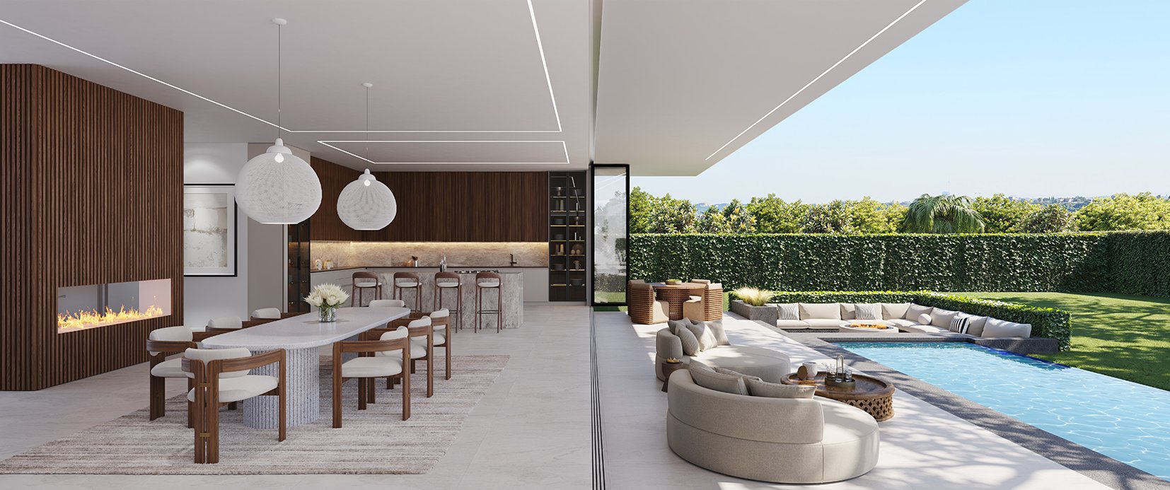Modern outdoor living space with a pool, sun loungers, and a covered patio featuring a dining table, chairs, and a bar area with stools, surrounded by greenery.