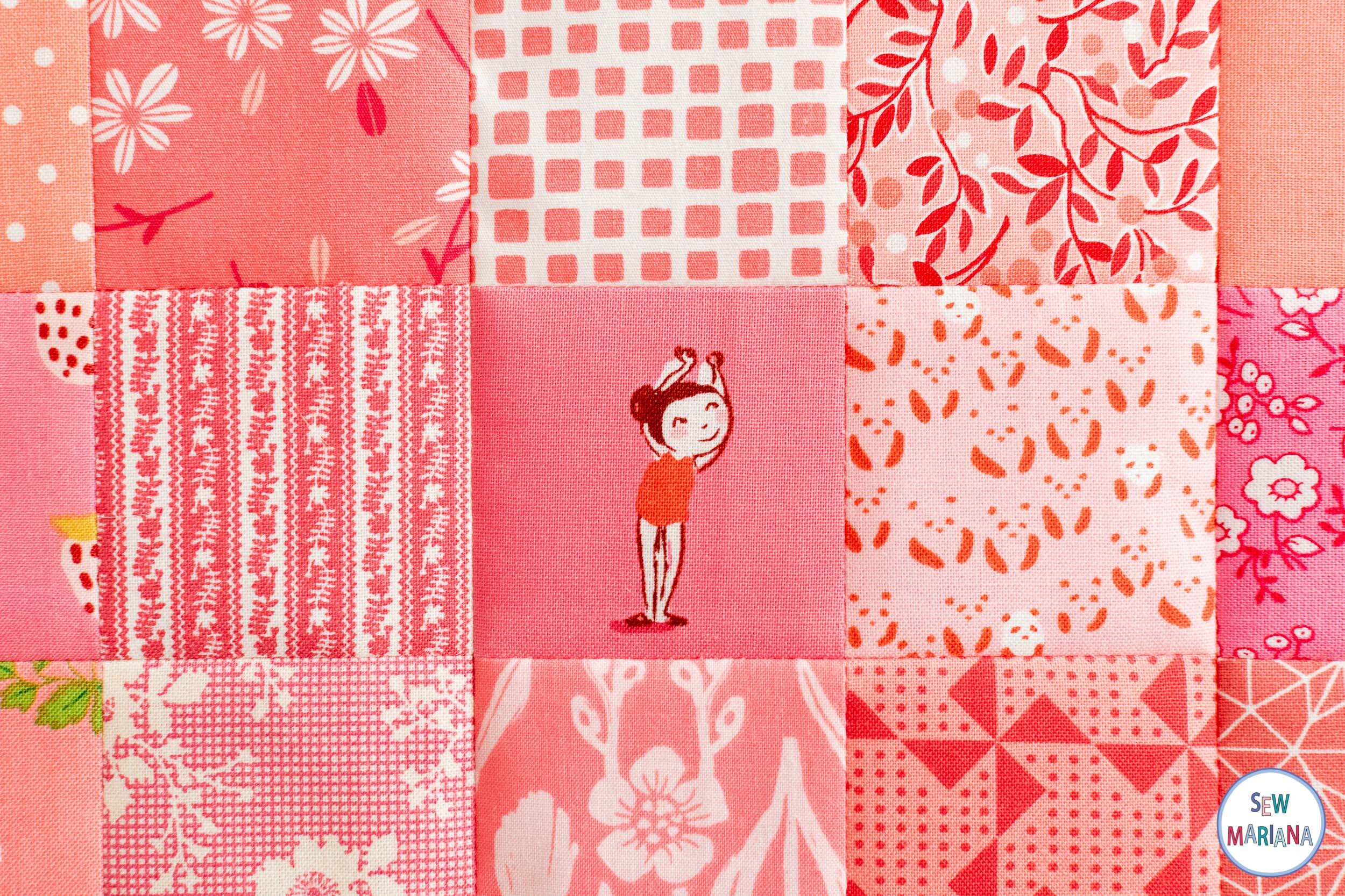 Detail of a square of fabric in pink with a girl